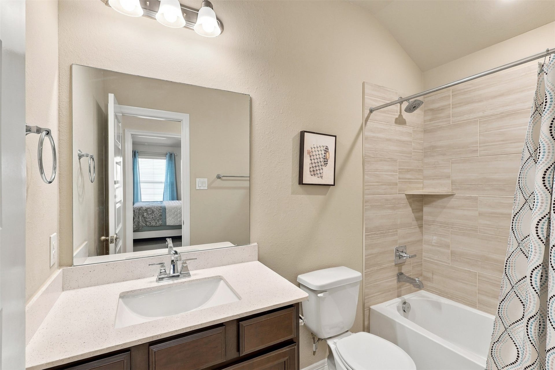 1719 Country Air Lane, Missouri City, TX 77459 WOW! EVEN THE GUEST BATHROOM IS DESIGNED TO IMPRESS! Gorgeous upgraded QUARTZ countertops with a stylish backsplash, a deep undermount sink, and beautiful designer tile surrounding the tub and shower create a stunning blend of elegance and everyday comfort! And don't overlook those VANITY DRAWERS! Unlike many homes with limited bathroom storage, this beauty offers convenient drawers to keep your essentials!