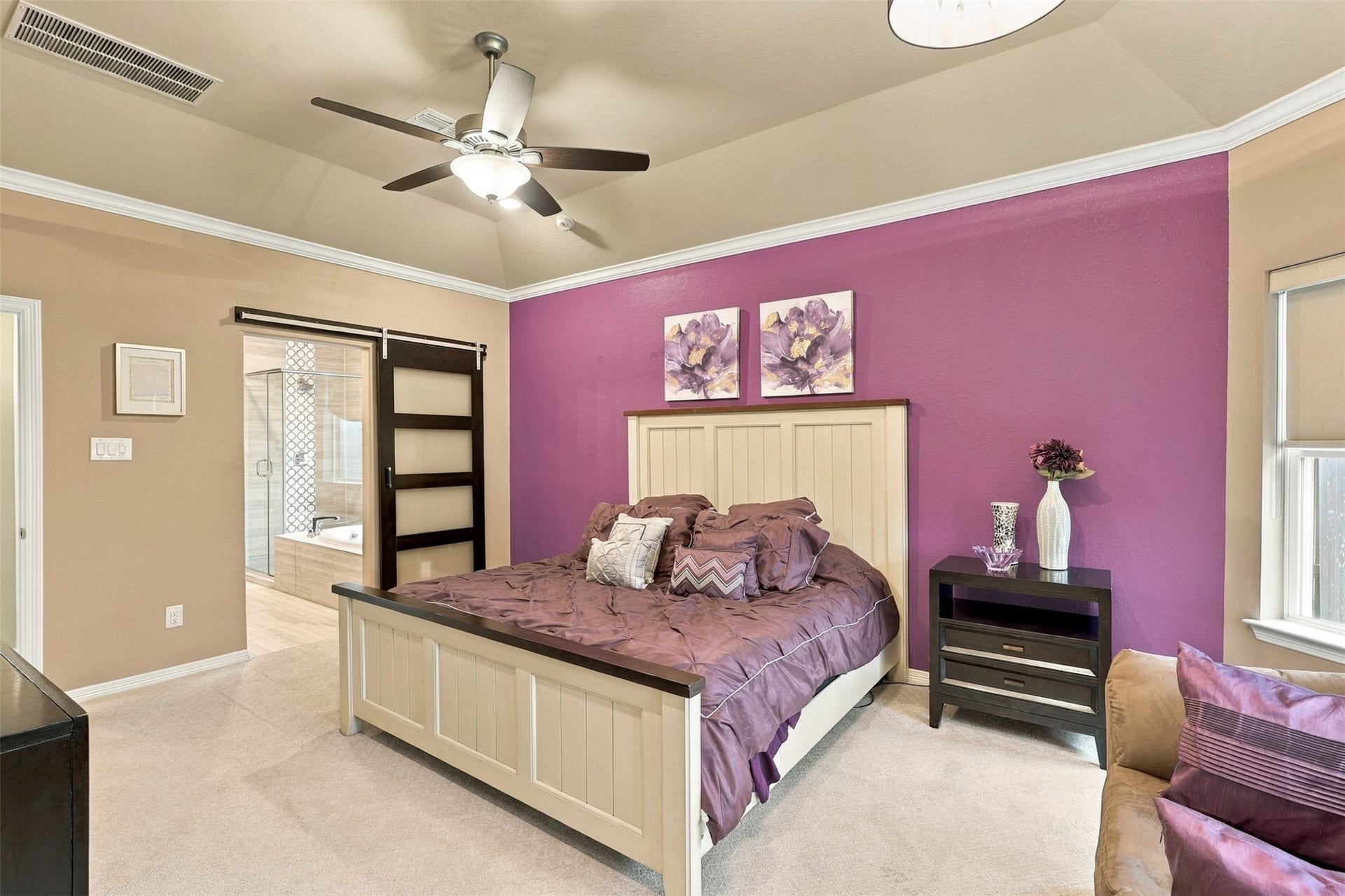 1719 Country Air Lane, Missouri City, TX 77459 YOUR LUXURIOUS PRIVATE RETREAT AWAITS! Escape into this BREATHTAKING primary suite, where elegance, comfort, and timeless beauty come together! Magnificent high tray ceilings accented with exquisite crown molding create an impressive sense of grandeur, while the stunning custom barn door adds a touch of designer charm and character! Imagine coming home after a long day, closing the door, and enjoying the peace and tranquility of your very own sanctuary!