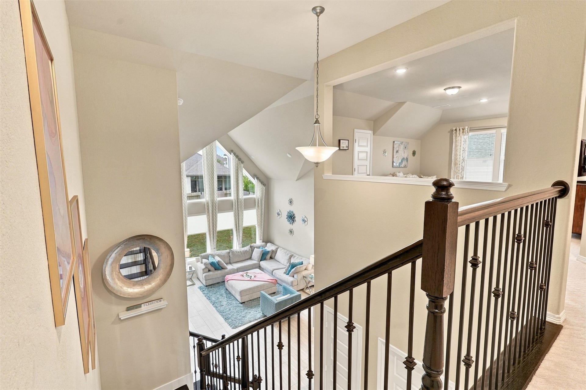 1719 Country Air Lane, Missouri City, TX 77459 Elegant open railings overlook the STUNNING two-story family room below, where soaring ceilings and impressive walls of windows create an unforgettable WOW FACTOR! Natural light fills this incredible open space, showcasing the home's timeless elegance and grand design! Follow the RIGHT WING and discover the FABULOUS PRIVATE MEDIA ROOM and More!