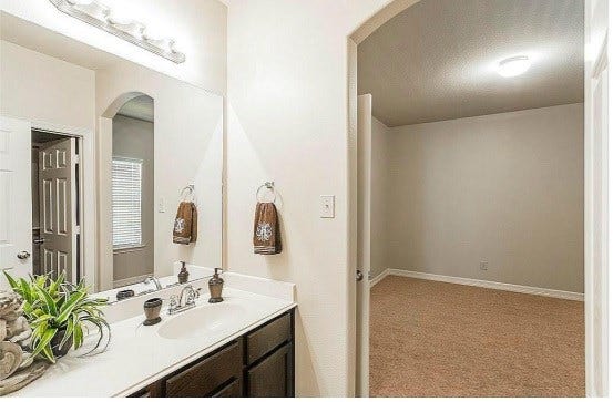 56 Woodland Hills Drive, #B, Conroe, TX 77303 note: this picture does not reflect updated new grey vinyl laminate flooring in bedrooms.