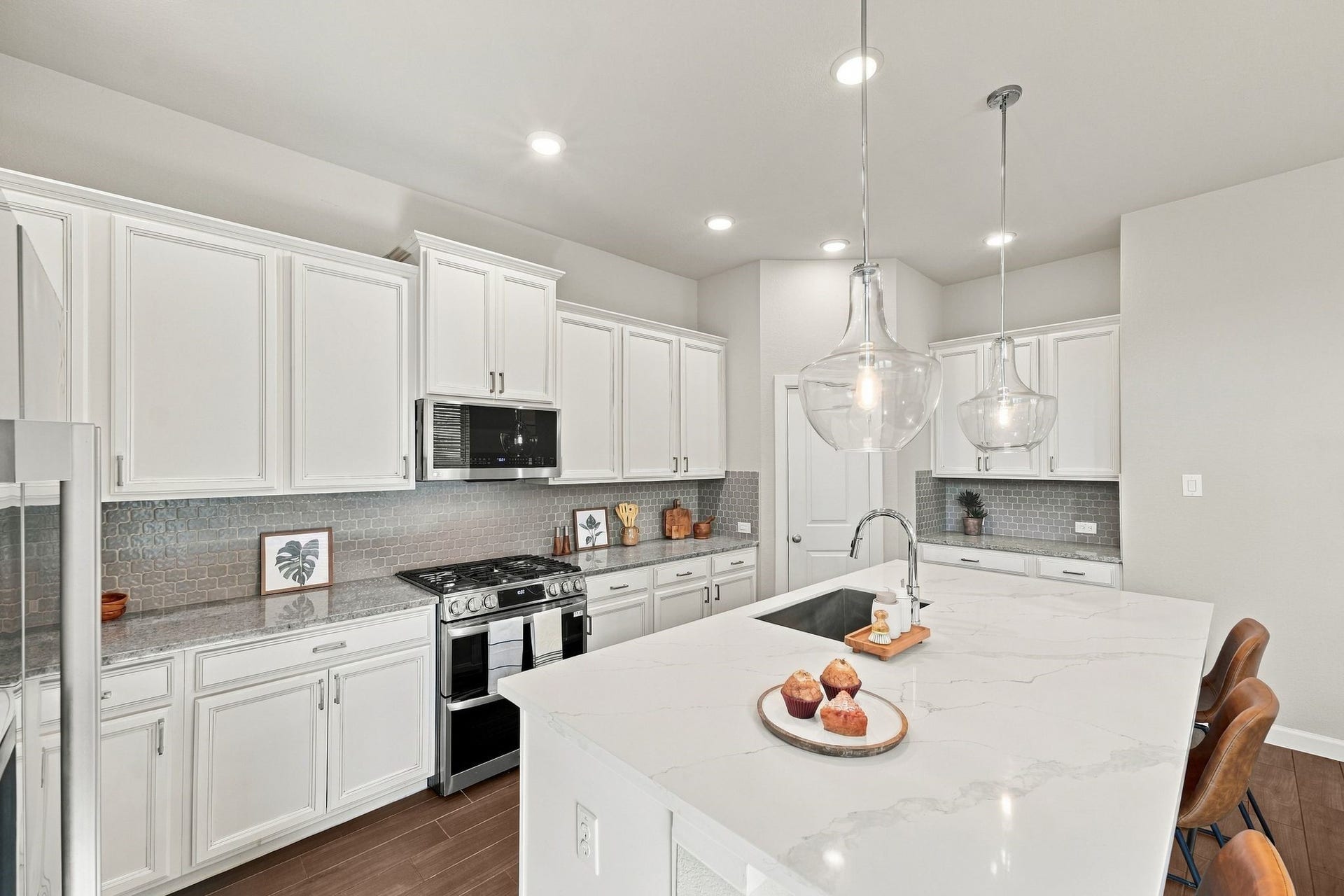27022 Brighton Valley Way SW, Katy, TX 77494 This is the one. The kitchen everyone will fight over. A brand new quartz island, white stained cabinetry, and enough counter space for a real cook, not just a photo.