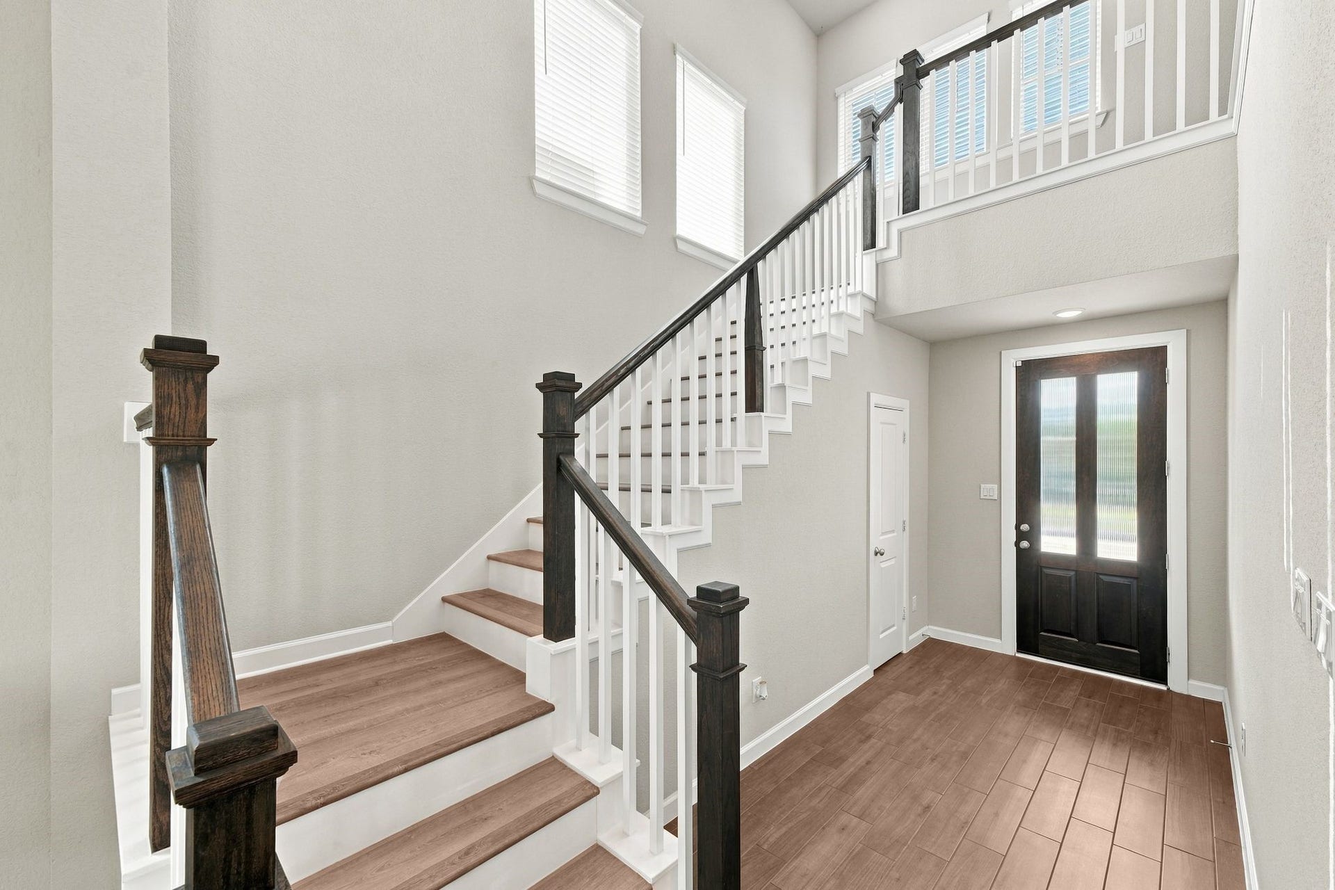 27022 Brighton Valley Way SW, Katy, TX 77494 Warm wood tone stairs and a light filled foyer set the tone from the first step.