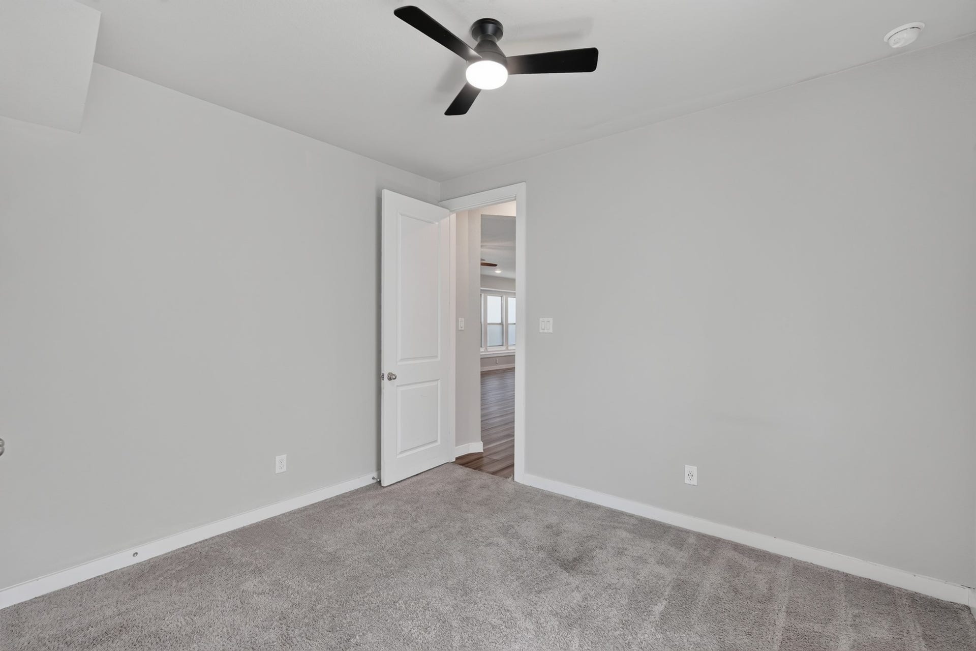 706 Santa Elena Trail, Conroe, TX 77304 Another secondary bedroom with soft carpet, a ceiling fan, and a neutral palette that makes decorating simple and personal. Clean, bright, and move-in ready this versatile room adapts easily to whatever purpose your household needs most right now.