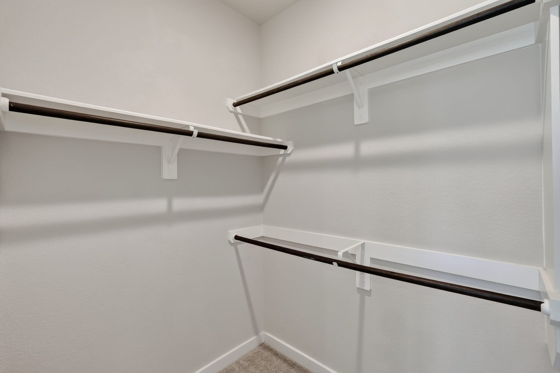 706 Santa Elena Trail, Conroe, TX 77304 The primary suite's walk-in closet provides generous rod space and room for custom shelving a practical luxury that makes everyday organization effortless. Large enough to accommodate an extensive wardrobe with ease, comfort, and lasting everyday style.