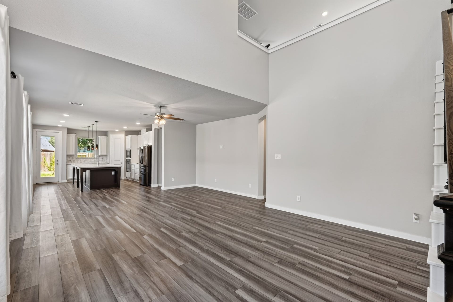 706 Santa Elena Trail, Conroe, TX 77304 The open-concept main living area flows beautifully from the foyer dark hardwood-style floors, an abundance of natural light, and an expansive layout that keeps you connected to every part of the home. Airy, inviting, and perfectly move-in ready.