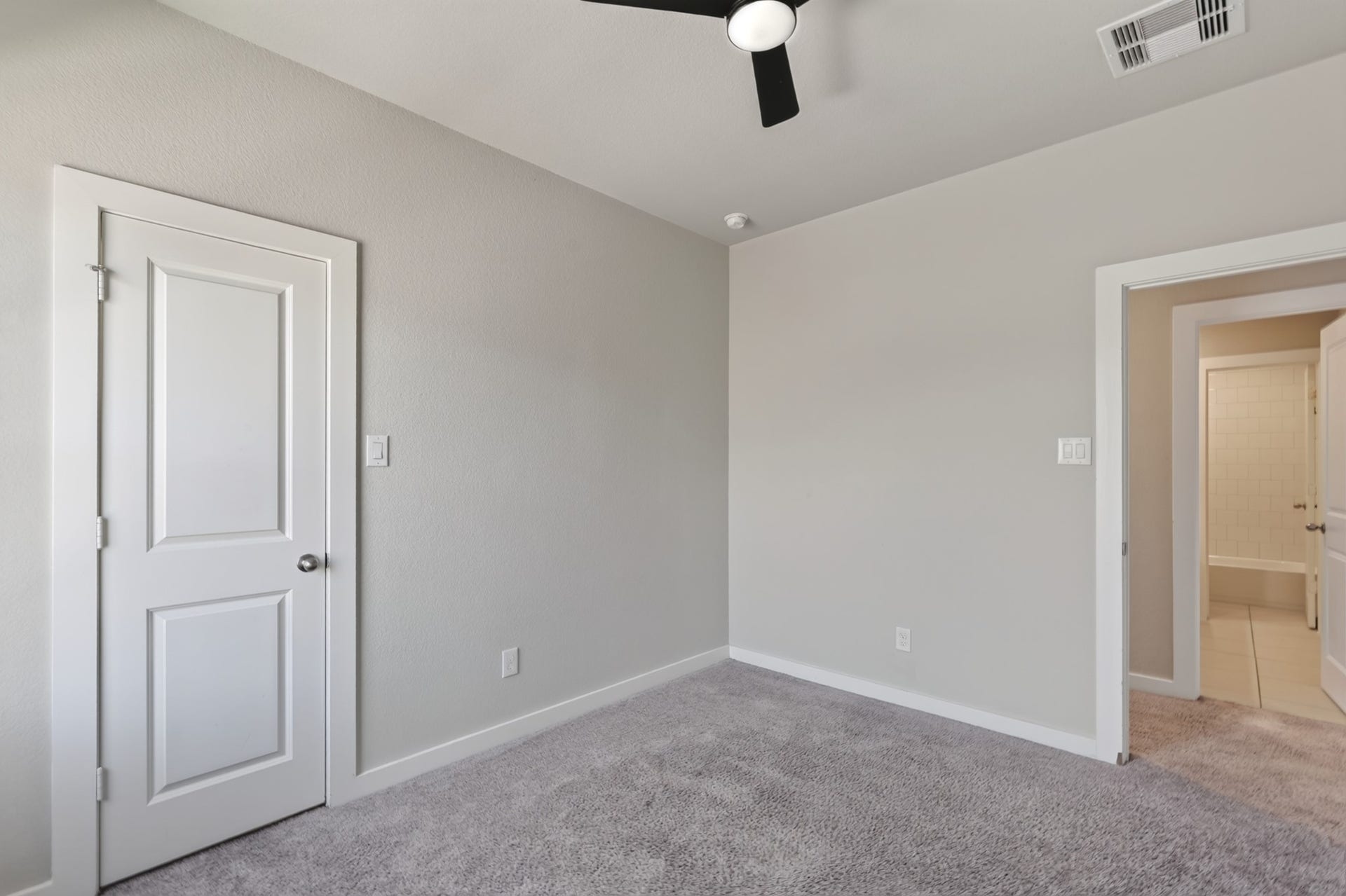 706 Santa Elena Trail, Conroe, TX 77304 Secondary bedroom with plush carpet, a ceiling fan, and a closet neutral walls and quality finishes make this room move-in ready and easy to personalize. A warm and comfortable space perfectly suited for family, guests, or flexible everyday household use.