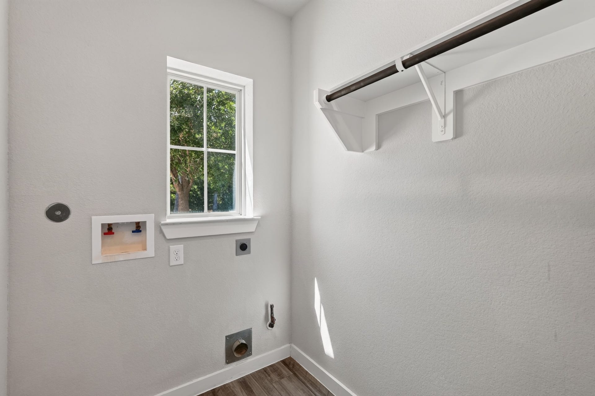 706 Santa Elena Trail, Conroe, TX 77304 Additional bathroom or utility space featuring a window for natural light clean, bright, and well-maintained. Functional neutral finishes and easy-care surfaces make this space both practical for daily use and a natural complement to the home's overall layout.