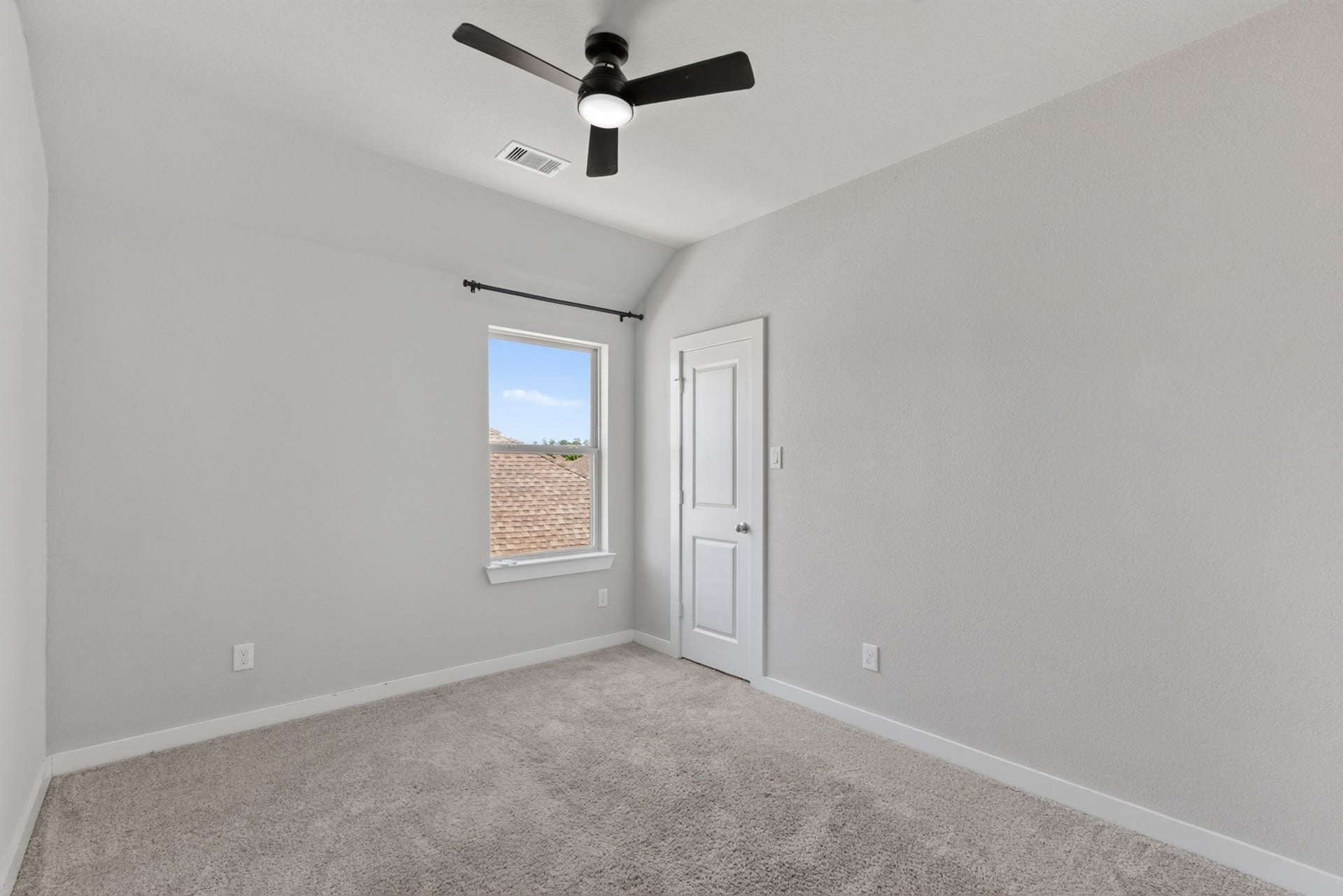 706 Santa Elena Trail, Conroe, TX 77304 Upper-level secondary bedroom featuring a ceiling fan, soft carpet, and windows for natural light a comfortable and private retreat for family or guests. Clean, bright, and move-in ready, this room is the perfect space to make your own from day one.