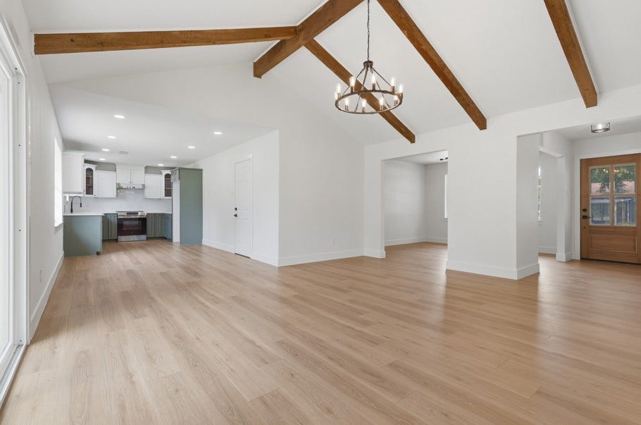 104 Oriole Lane, Angleton, TX 77515 Welcome Home! This beautifully renovated property is nestled in the peaceful Angleton area and offers modern updates with timeless charm. The inviting living space features abundant natural light, vaulted wood beam ceilings, and beautiful wood floors throughout.