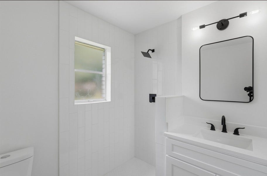 104 Oriole Lane, Angleton, TX 77515 The primary bathroom features a modern standing shower, creating a clean and functional space designed for everyday comfort. Thoughtful finishes and a simple layout provide a fresh, inviting atmosphere.