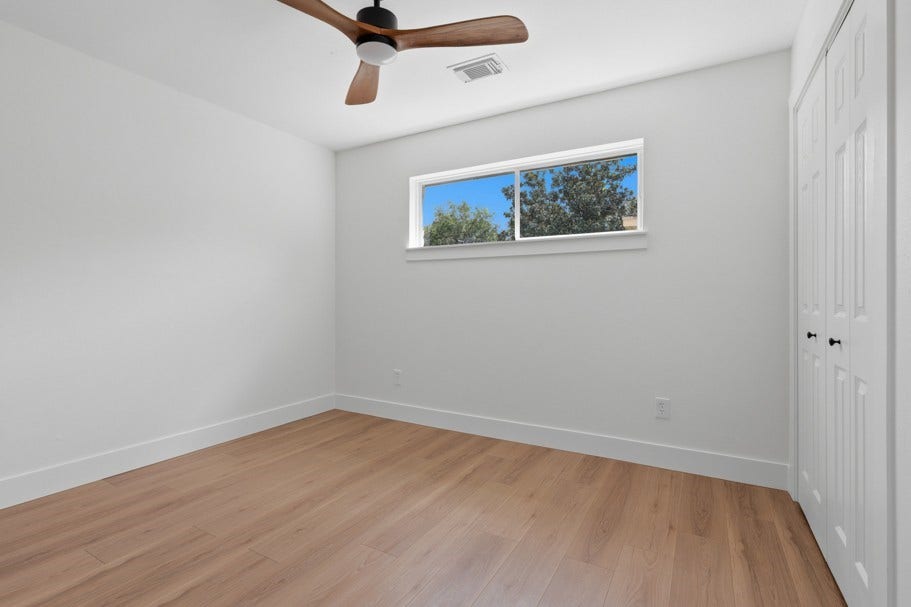 104 Oriole Lane, Angleton, TX 77515 The spacious bedrooms are complemented by abundant natural light, beautiful wood floors, and new ceiling fans, creating a comfortable and inviting retreat.