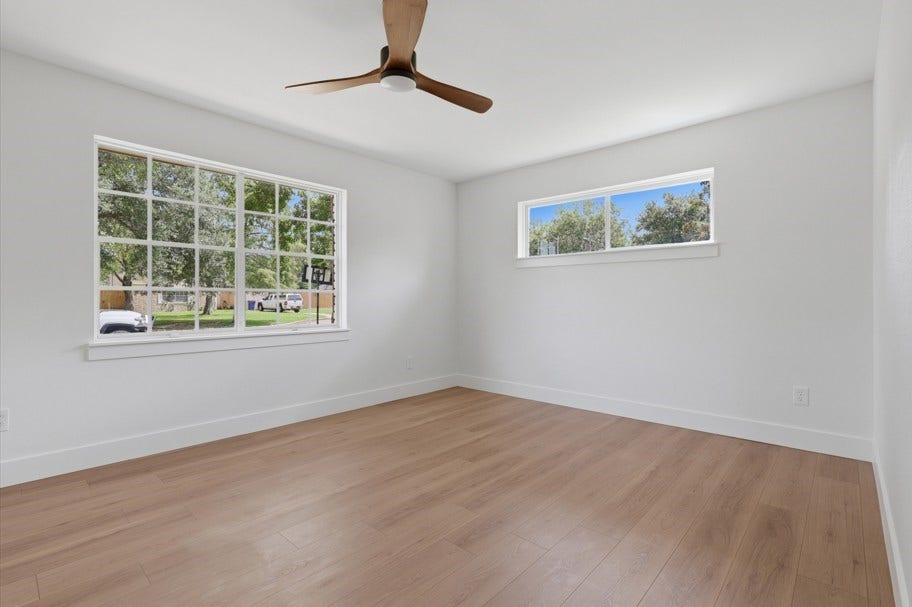 104 Oriole Lane, Angleton, TX 77515 The spacious bedrooms are complemented by abundant natural light, beautiful wood floors, and new ceiling fans, creating a comfortable and inviting retreat.