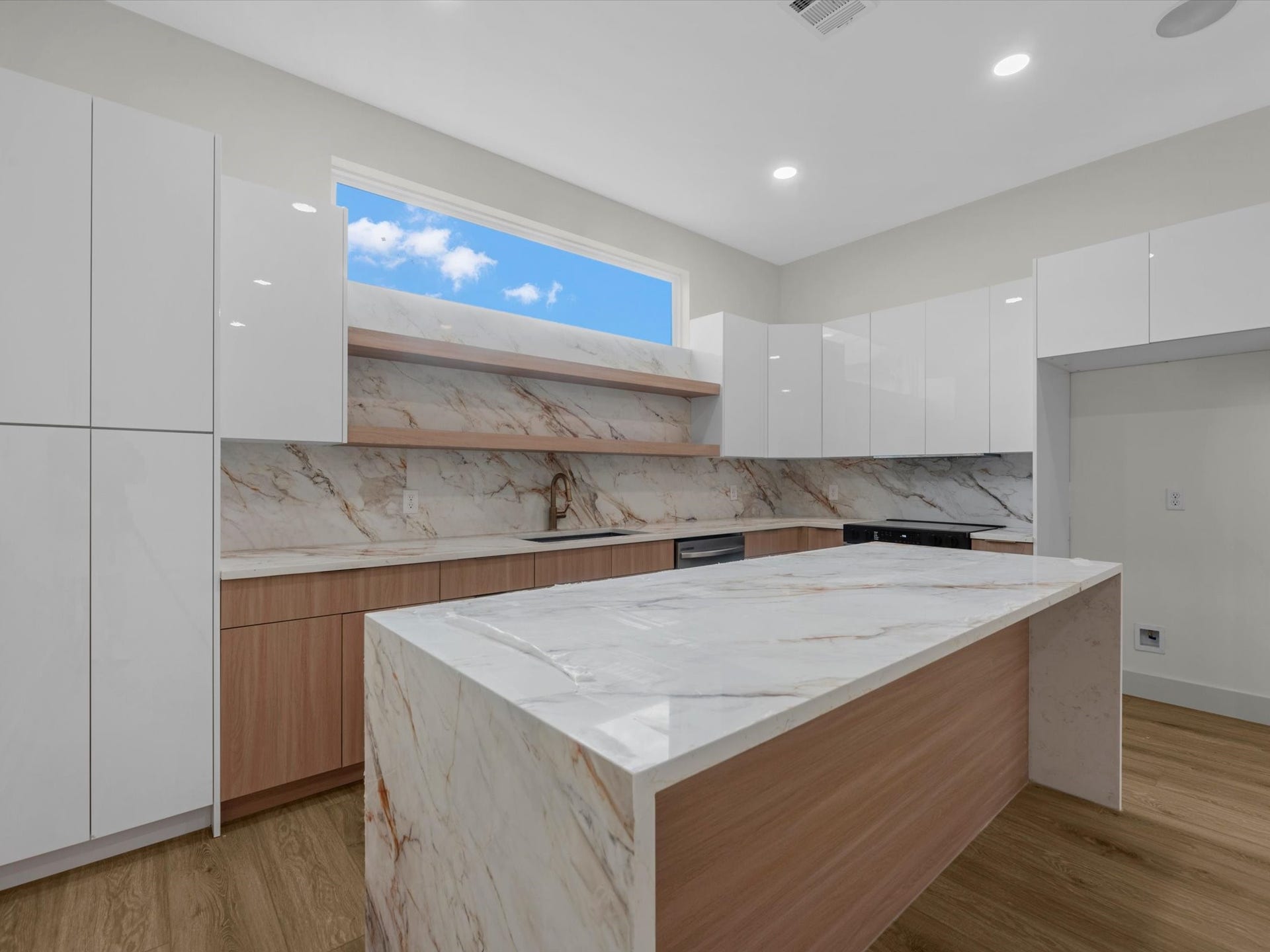 3307 Delhi Street, Houston, TX 77022 Unit 2: Waterfall countertop in kitchen island