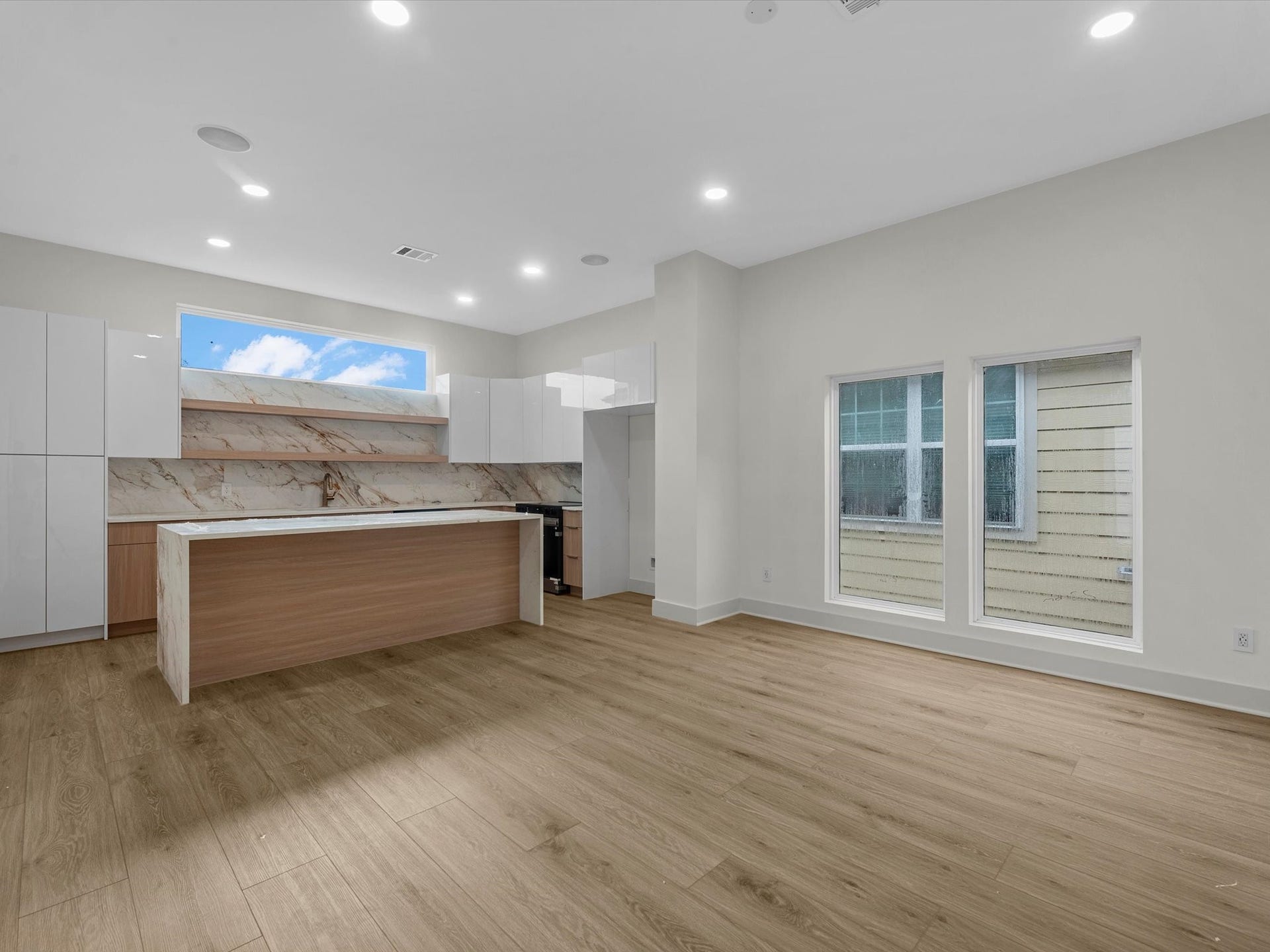 3307 Delhi Street, Houston, TX 77022 Unit #2: Kitchen with two toned cabinets and modern quartz countertops