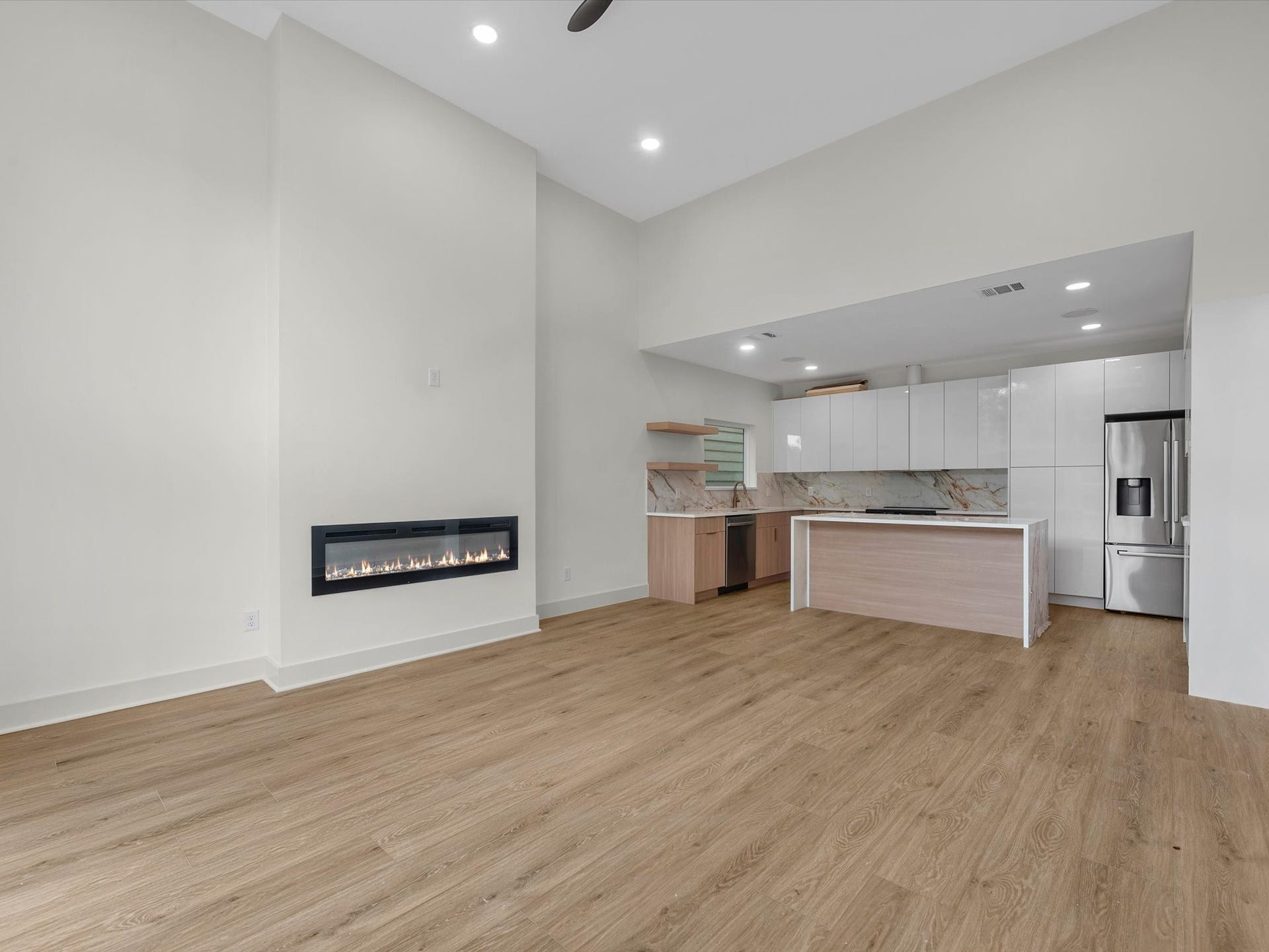 3307 Delhi Street, Houston, TX 77022 Unit #1 (first floor): Two story living room area, with fire place