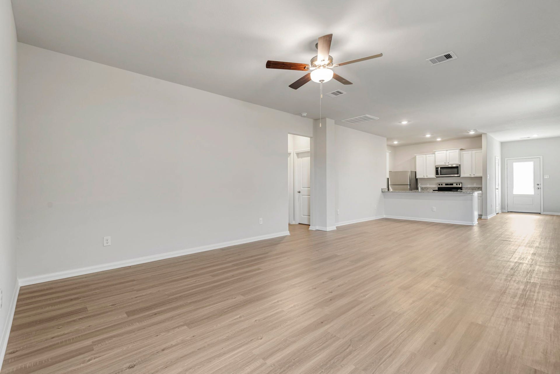 6411 Winter Elm Street, Houston, TX 77048 The open concept in the living room offers plenty of space to gather with your family and friends.