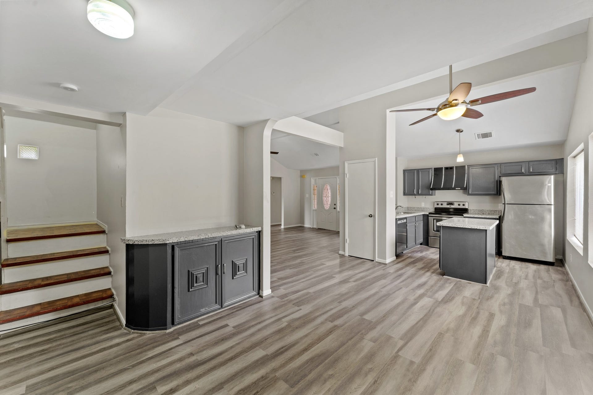 3926 Mill Rock Circle, Sugar Land, TX 77479 Situated next to the kitchen is the dining space which features additional storage and counter space, perfect for serving food and entertaining, as well as beautiful wood-look floors, a ceiling fan, and large windows!
