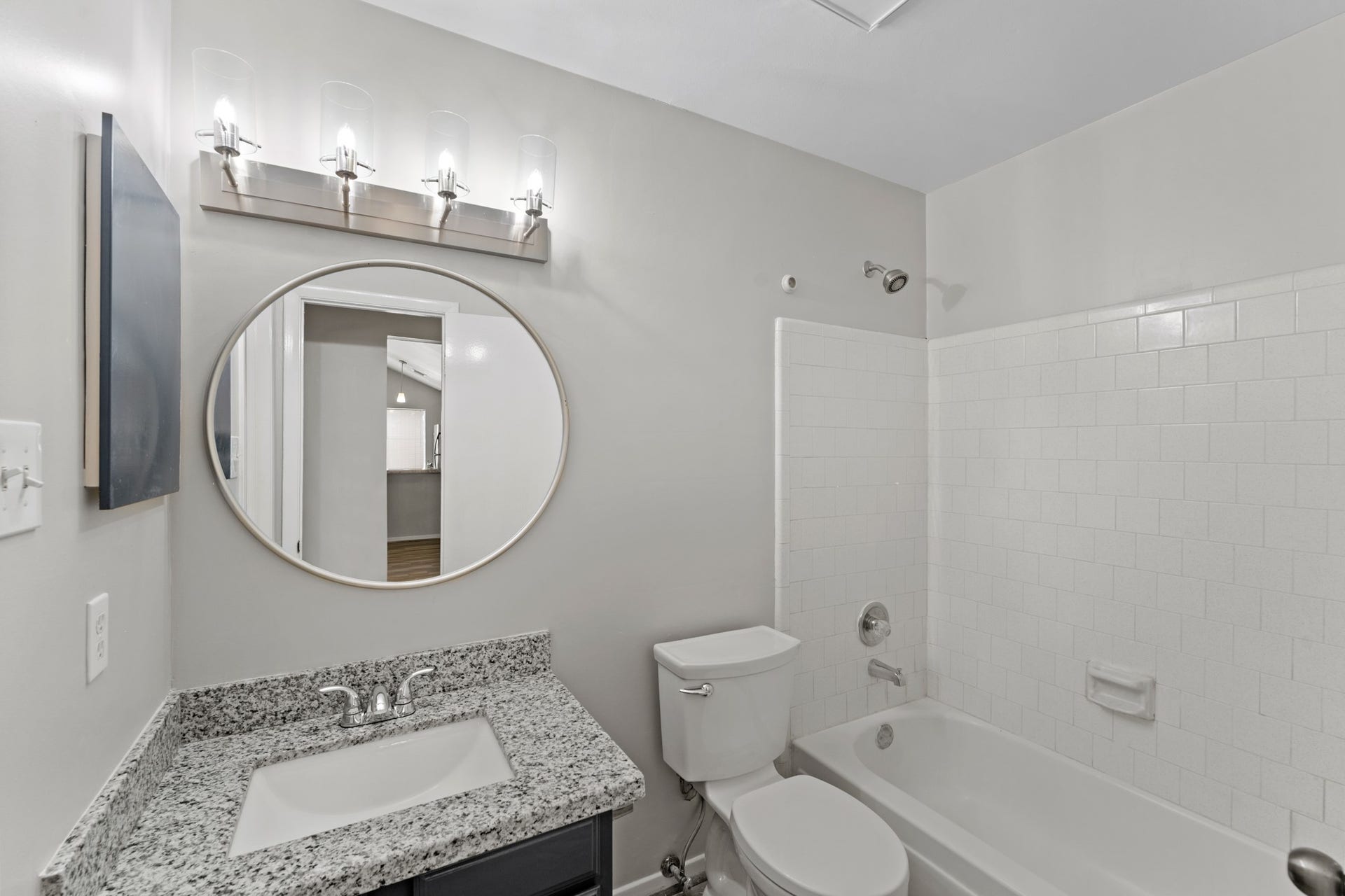 3926 Mill Rock Circle, Sugar Land, TX 77479 Secondary bathroom featuring granite countertops and a shower/tub combo.