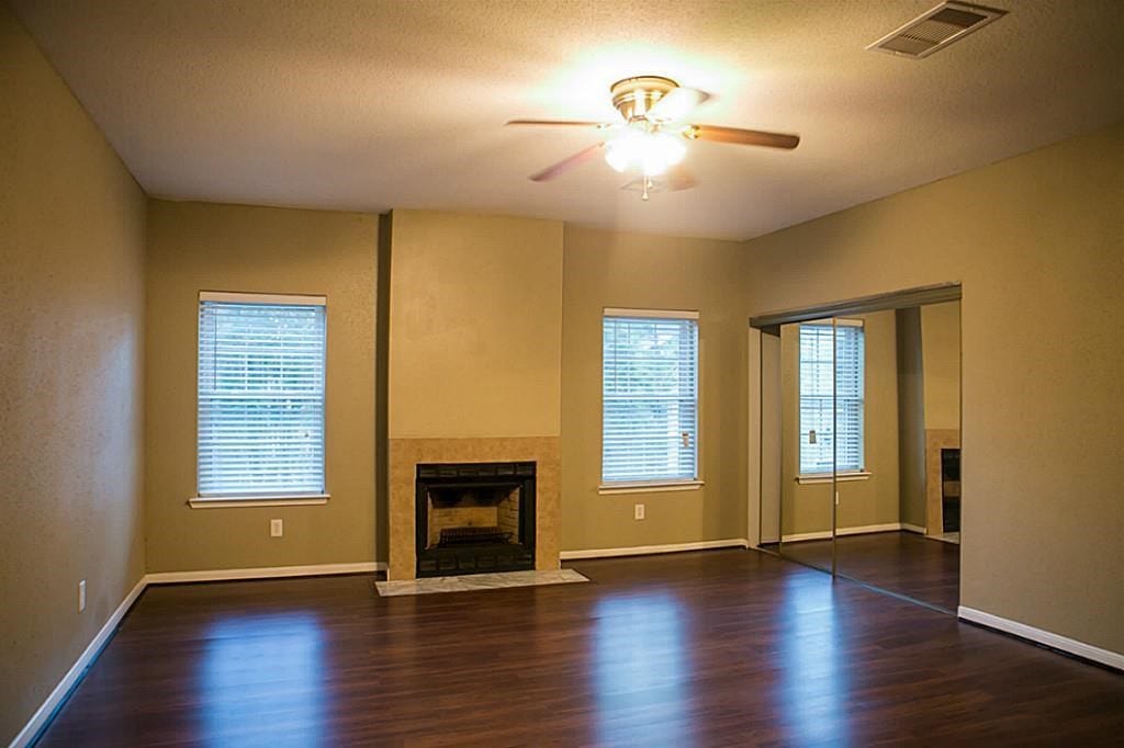 Wood burning fireplace inside master bedroom with new flooring