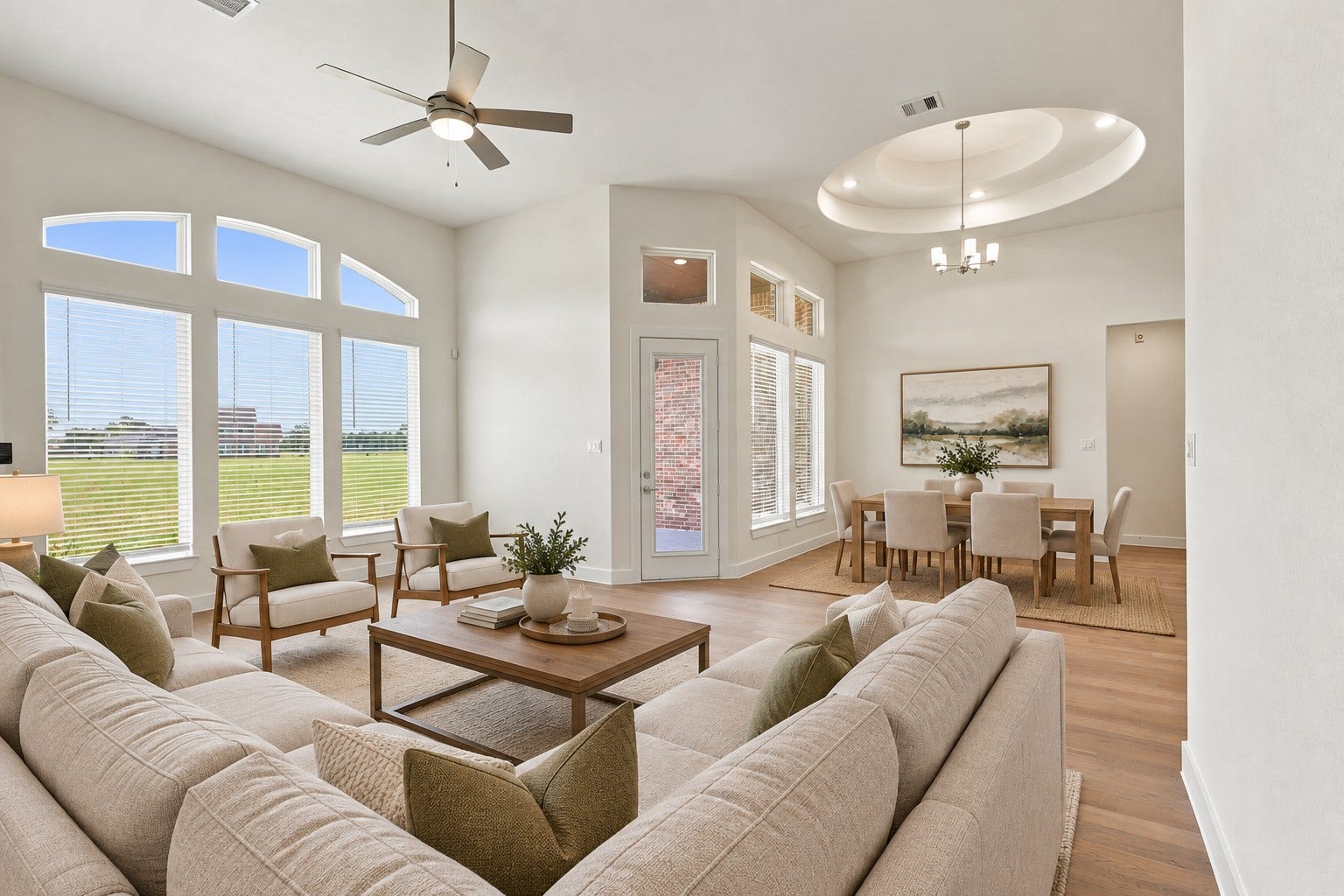 1051 Lakeland Circle, Rosharon, TX 77583 Prepare to be AMAZED by the BREATHTAKING SOARING CEILINGS and SPECTACULAR DESIGNER WINDOWS that fill this beautiful home with an abundance of NATURAL LIGHT! Notice the GORGEOUS WOOD FLOORING flowing gracefully from the family room into the inviting casual dining area, creating a seamless space for entertaining and everyday living! And there's MORE! These BEAUTIFUL INSULATED VINYL WINDOWS are designed for ENERGY EFFICIENCY, helping provide year-round comfort and potential utility saving! Virtual Staged!