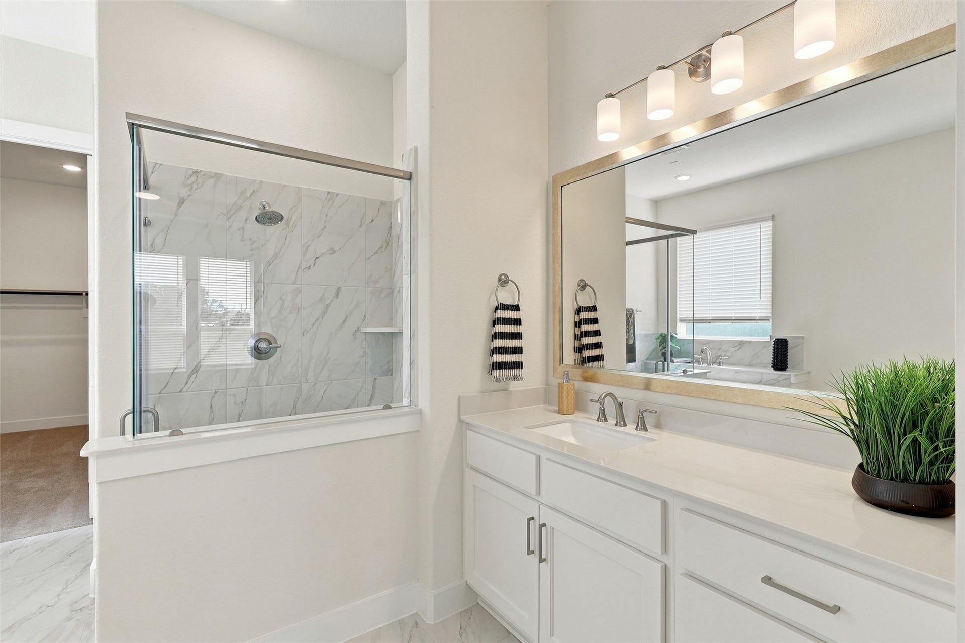 1051 Lakeland Circle, Rosharon, TX 77583 YOUR SPA-INSPIRED PRIMARY BATHROOM AWAITS! Start each morning surrounded by BEAUTY, COMFORT & EVERYDAY LUXURY! This STUNNING RETREAT showcases an EXTENDED VANITY with GORGEOUS QUARTZ COUNTERTOPS, a DEEP UNDERMOUNT SINK & an ELEGANT DESIGNER-FRAMED MIRROR! Notice the ABUNDANCE OF CABINETS & DRAWERS offering WONDERFUL STORAGE to keep everything beautifully organized! A PERFECT BLEND OF STYLE, FUNCTION & SOPHISTICATION! YOUR OWN PRIVATE ESCAPE!