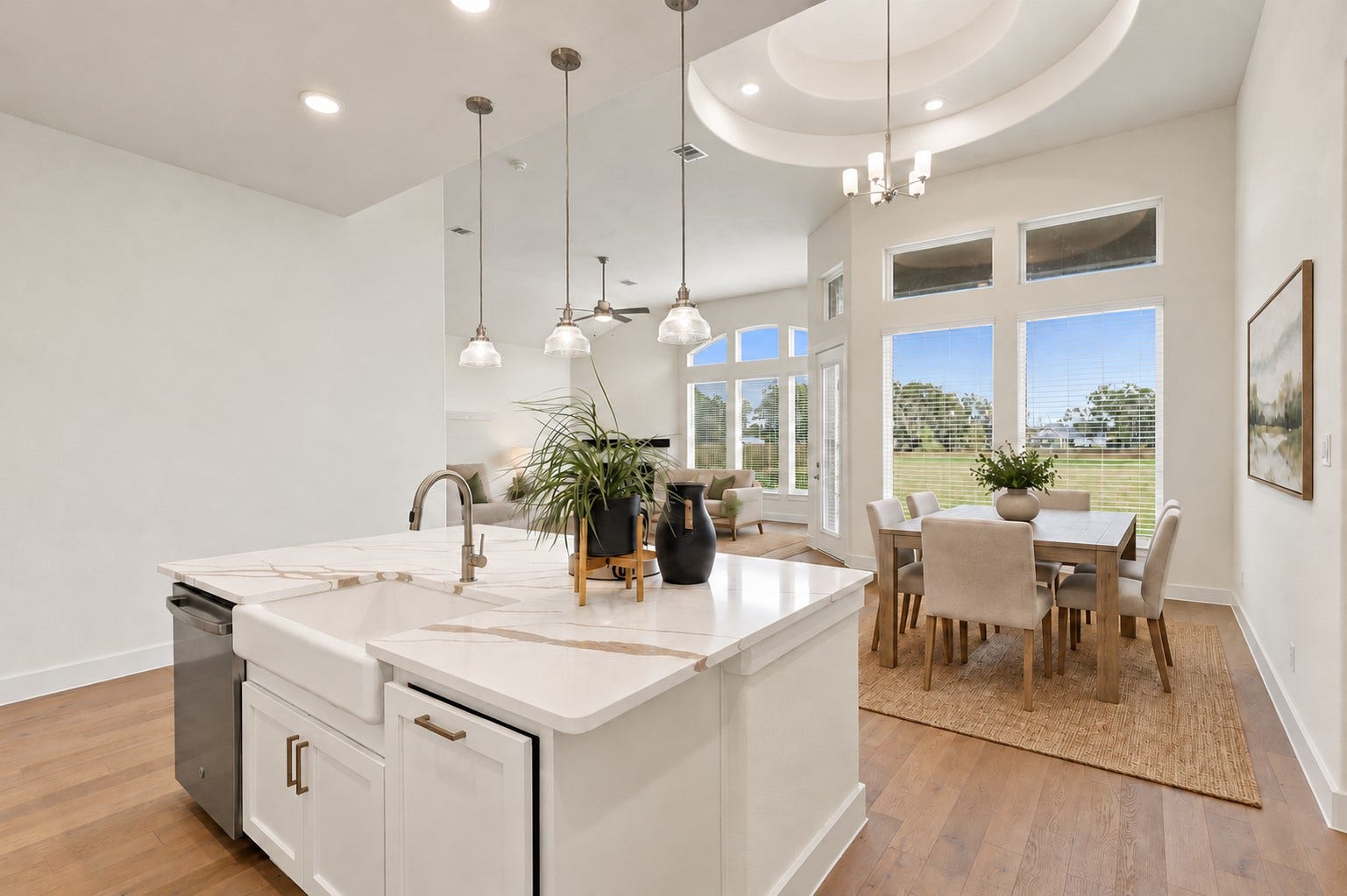 1051 Lakeland Circle, Rosharon, TX 77583 GORGEOUS KITCHEN & DINING IN PERFECT HARMONY! Prepare to be IMPRESSED by this spacious center island featuring gleaming QUARTZ countertops, crisp white cabinetry, and elegant pendant lighting! The adjoining dining area and open layout create a seamless connection between cooking, dining, and entertaining! BRIGHT, AIRY & BEAUTIFULLY DESIGNED, this is a place where wonderful memories begin! **Photo is Virtually Staged**
