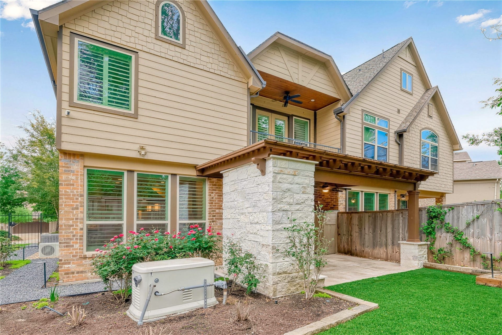 19 Herons Flight Place, Spring, TX 77389 Charming two-story home featuring a spacious patio, beautiful brick and stone exterior, and lush landscaping. Perfect for outdoor entertaining and relaxation.