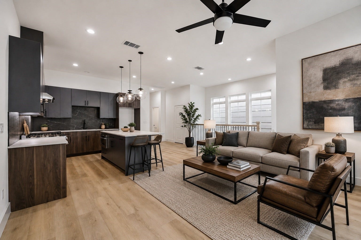 Open-concept view connecting kitchen, dining, and living spaces