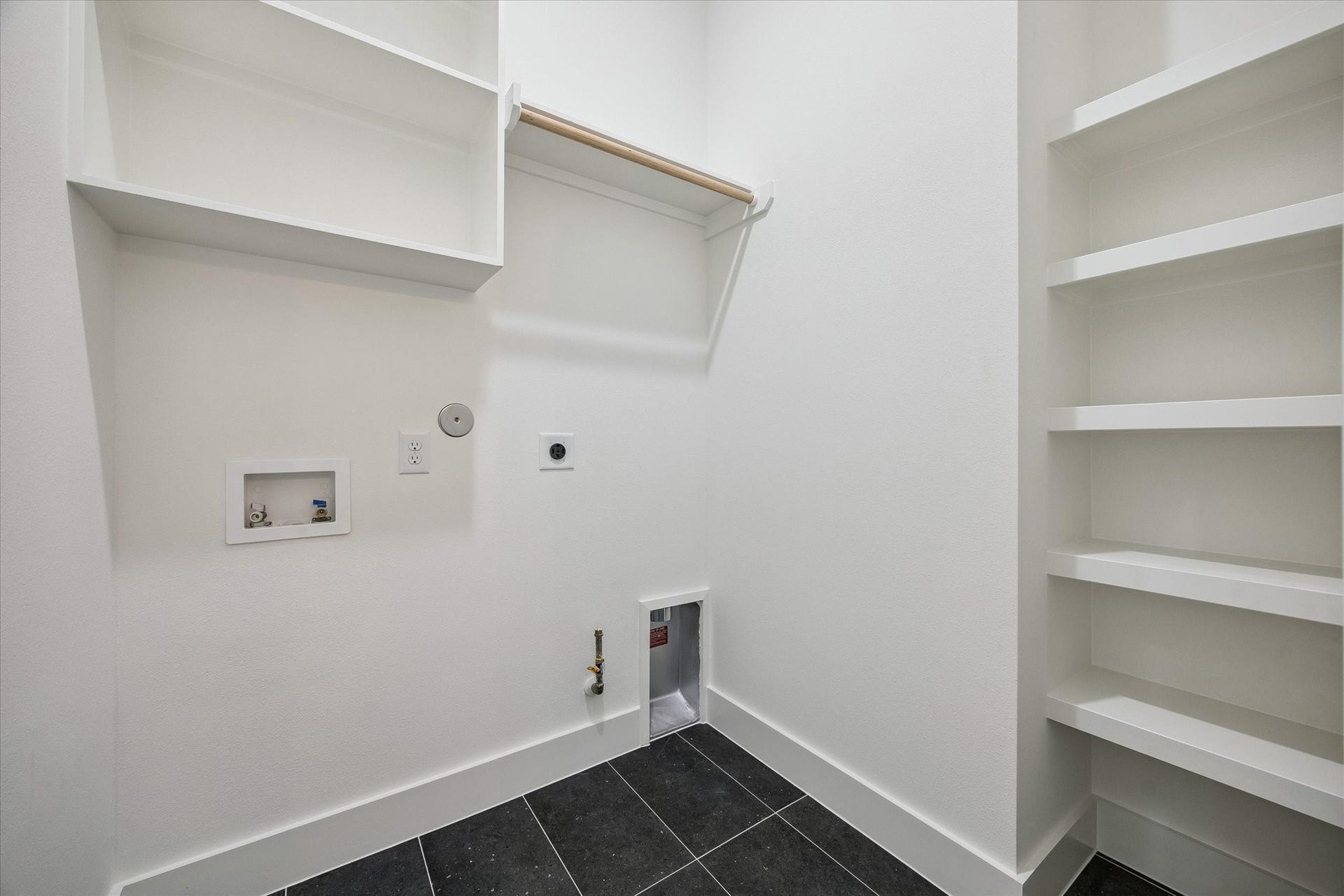 Utility area with built-in storage and clean laundry functionality