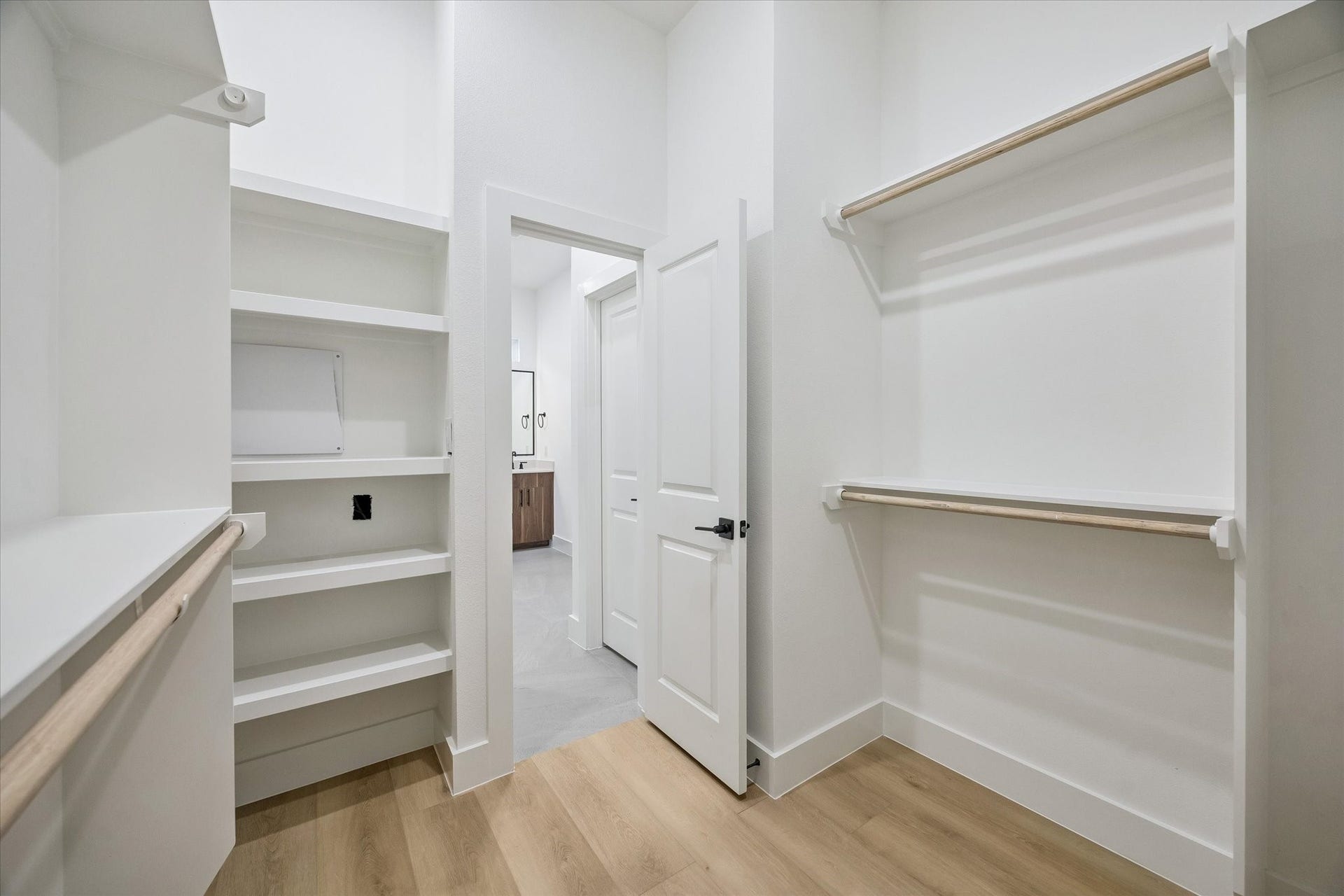 Oversized walk-in closet with built-in shelving and strong storage capacity