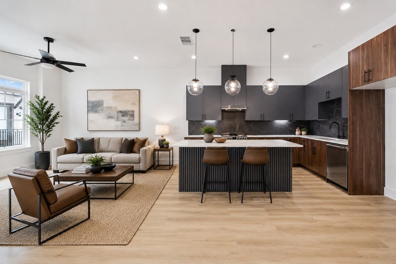 Showpiece kitchen with waterfall-style island, pendants, and wood accents