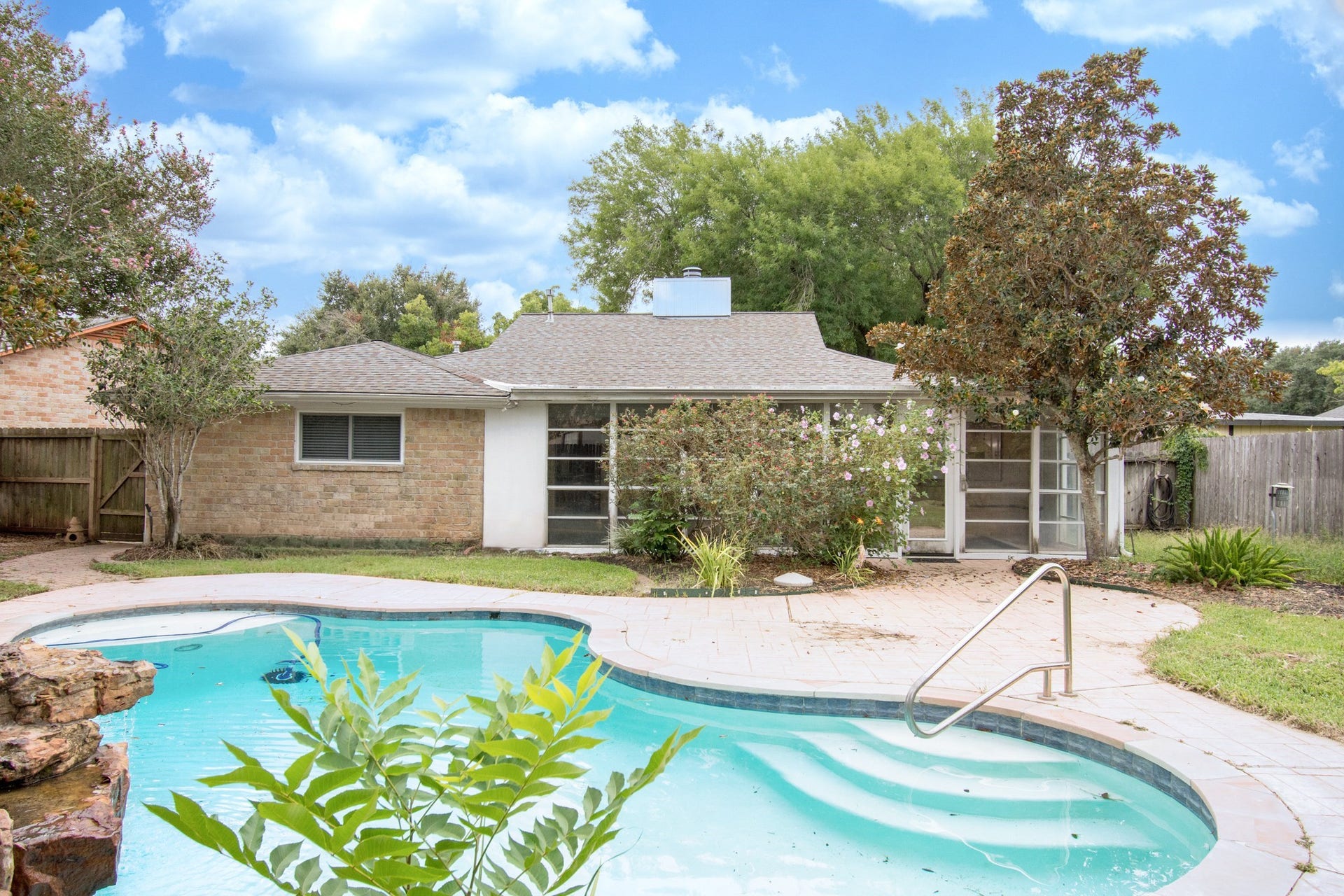 2507 Sage Brush Lane, Sugar Land, TX 77479 Swimming pool with water features!