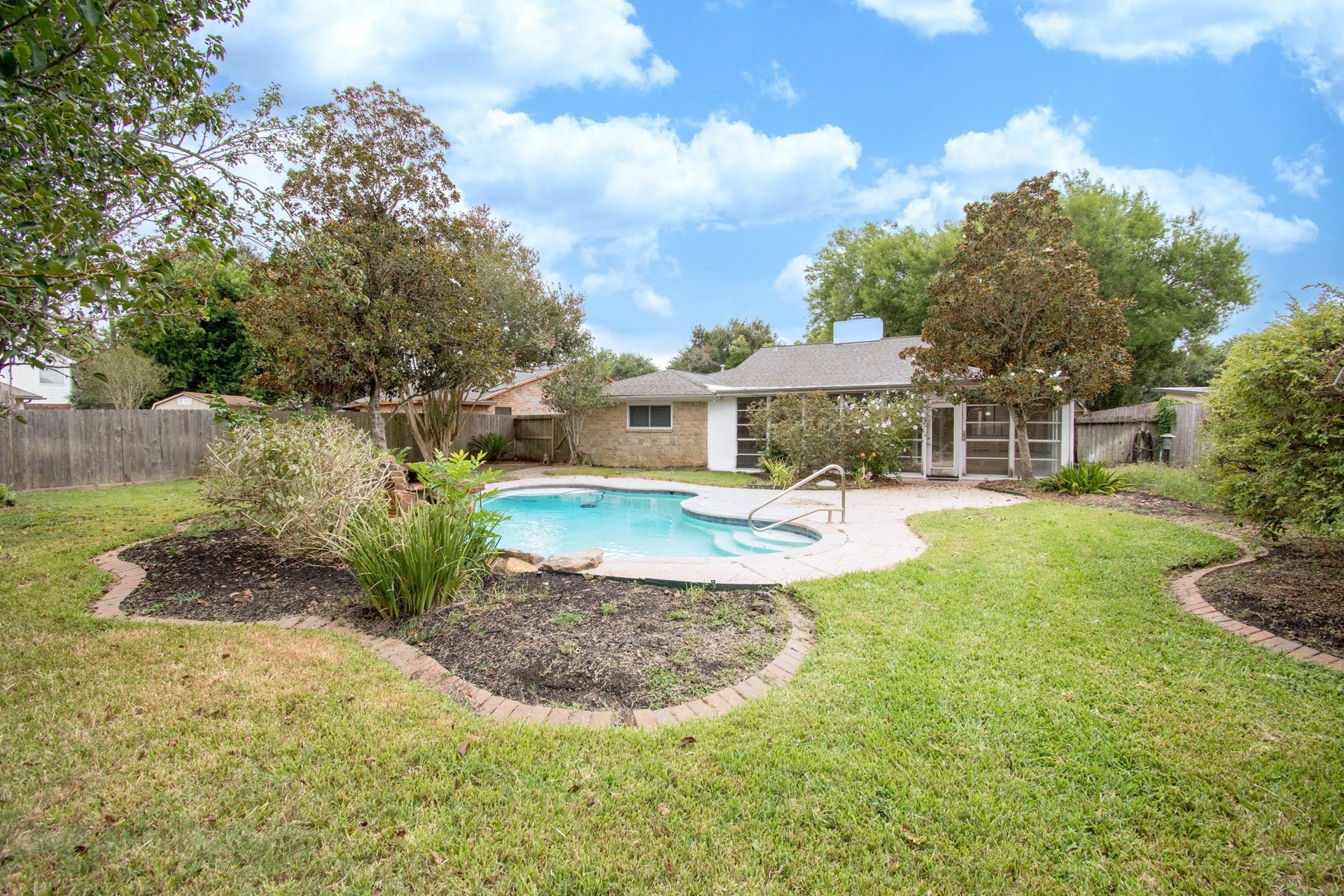 2507 Sage Brush Lane, Sugar Land, TX 77479 Move-in ready. This backyard not only has a pool, a shed, extensive decking, sprinklers but there's still a lot of yard left over!