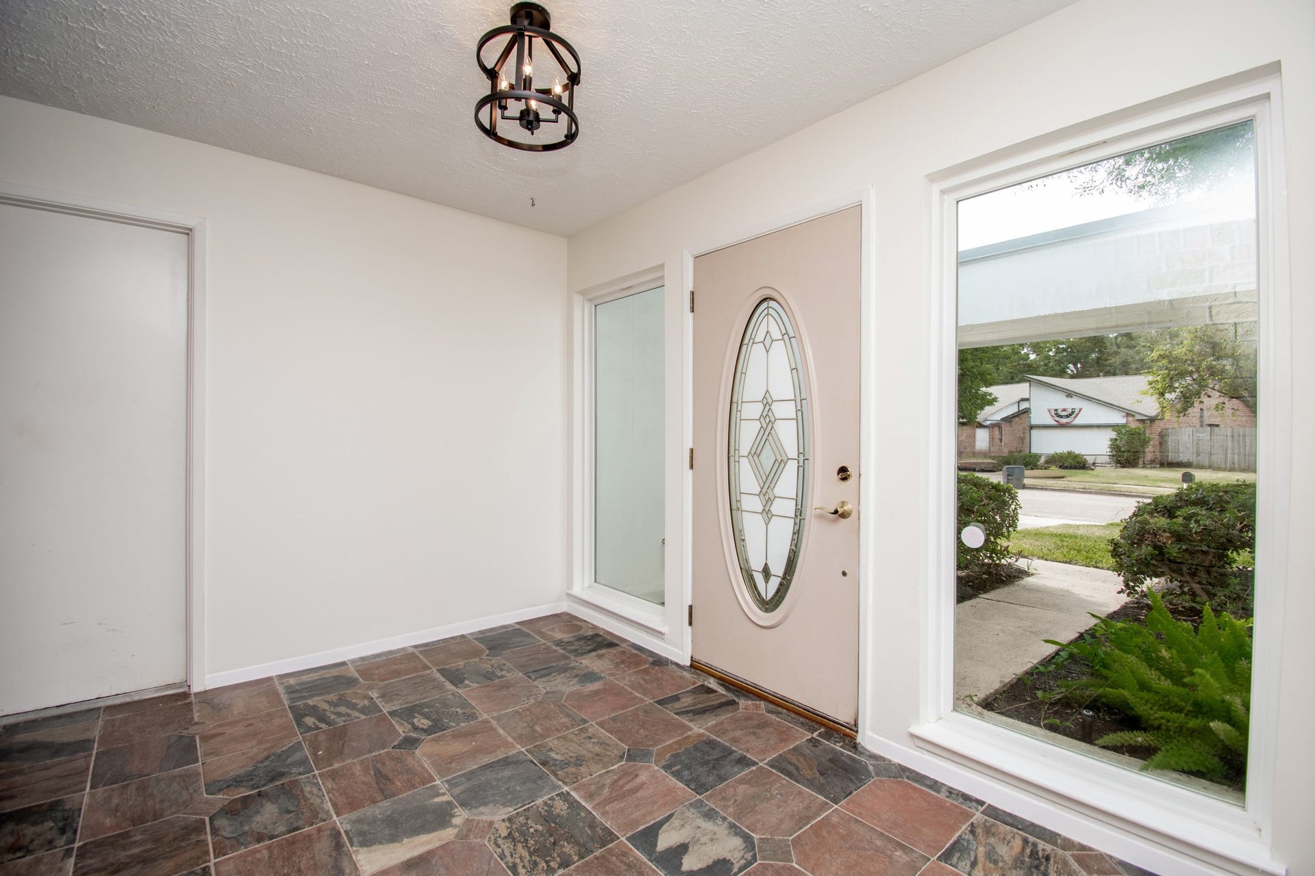 2507 Sage Brush Lane, Sugar Land, TX 77479 The inviting entry has large windows!