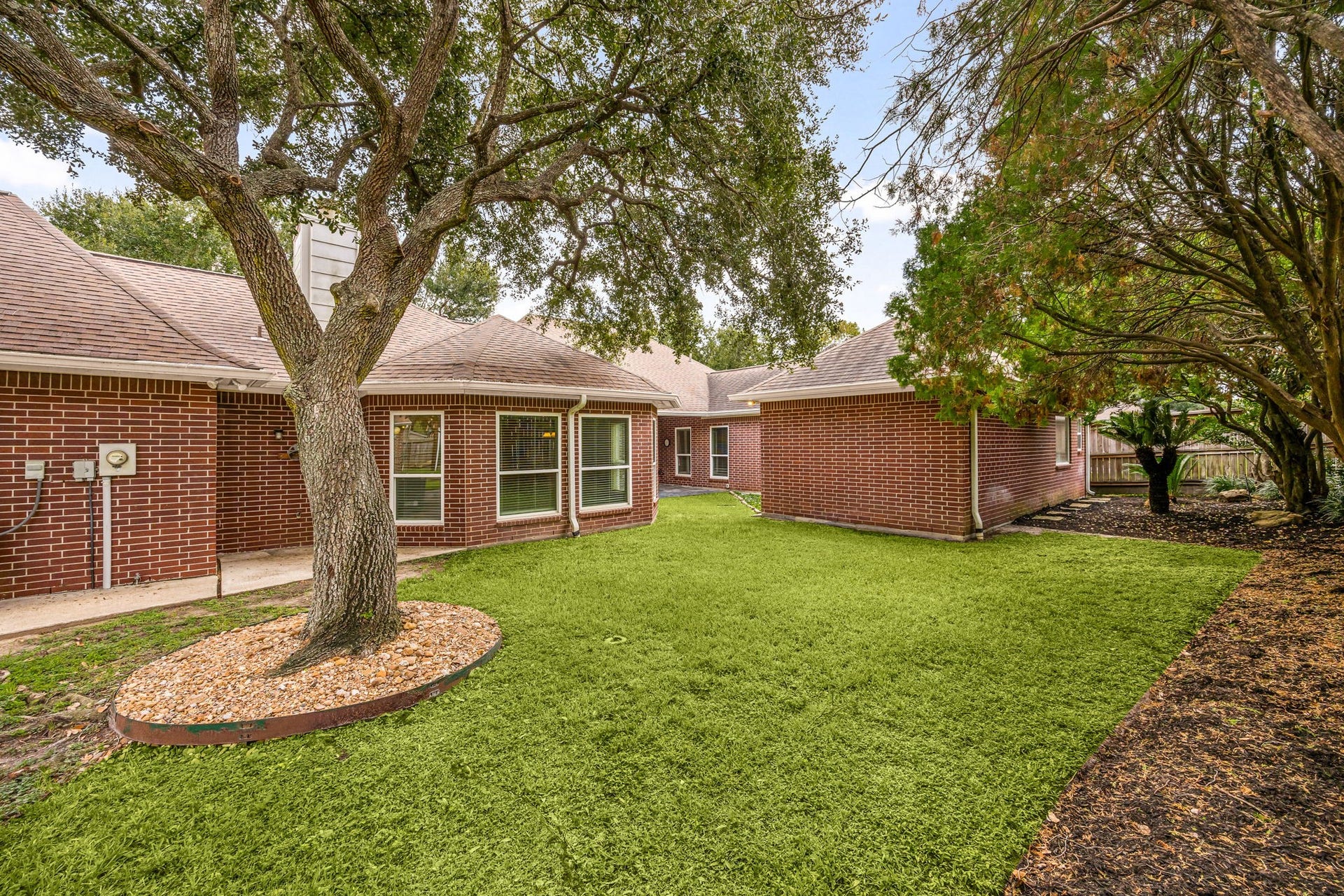 1602 Hannington Drive, Katy, TX 77450 Mature oaks shade much of the .44-acre double lot, giving the backyard a character increasingly hard to find in established Katy neighborhoods.