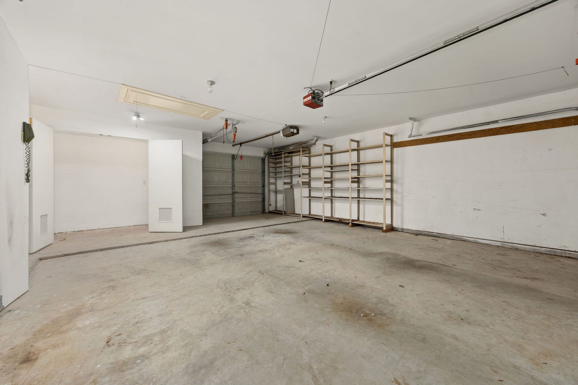 1602 Hannington Drive, Katy, TX 77450 The main-house garage adds substantial parking and storage, including built-in shelving and tandem/drive-through access.