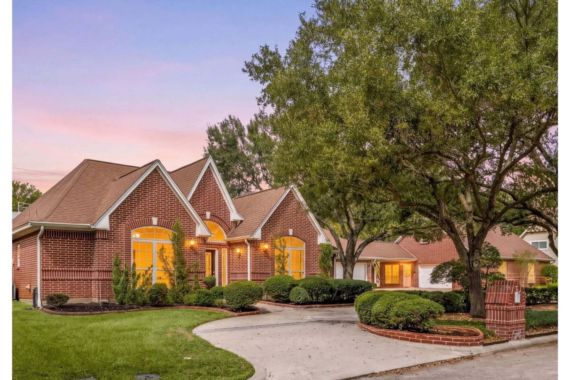 1602 Hannington Drive, Katy, TX 77450 As evening settles in, the home's wide one-story profile, mature trees and welcoming entry take on an entirely different feel.