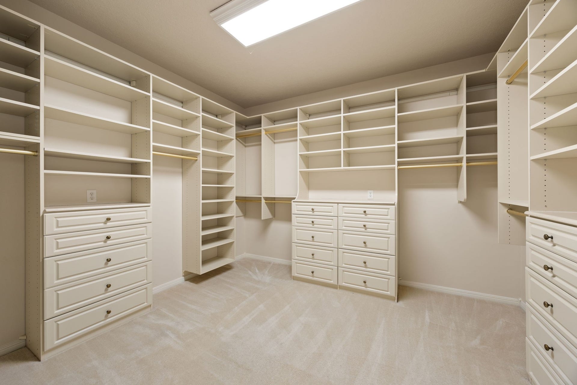 1602 Hannington Drive, Katy, TX 77450 One of two primary walk-in closets, which has been fully built out with custom shelving, drawers and hanging space.