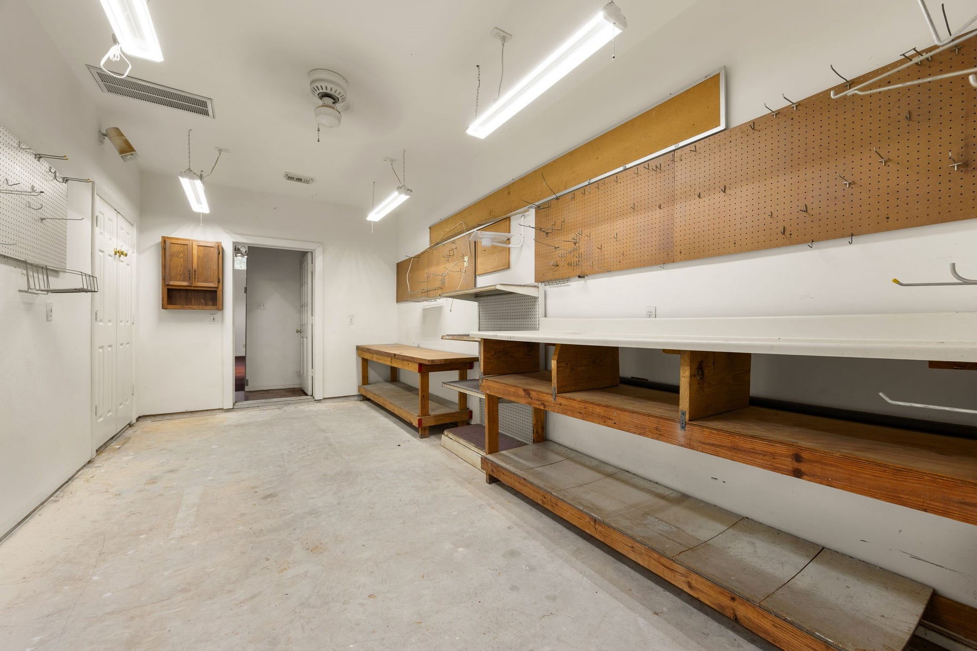 1602 Hannington Drive, Katy, TX 77450 The climate-controlled workshop is already outfitted with workbenches and pegboard, creating serious space for projects, hobbies or additional storage.