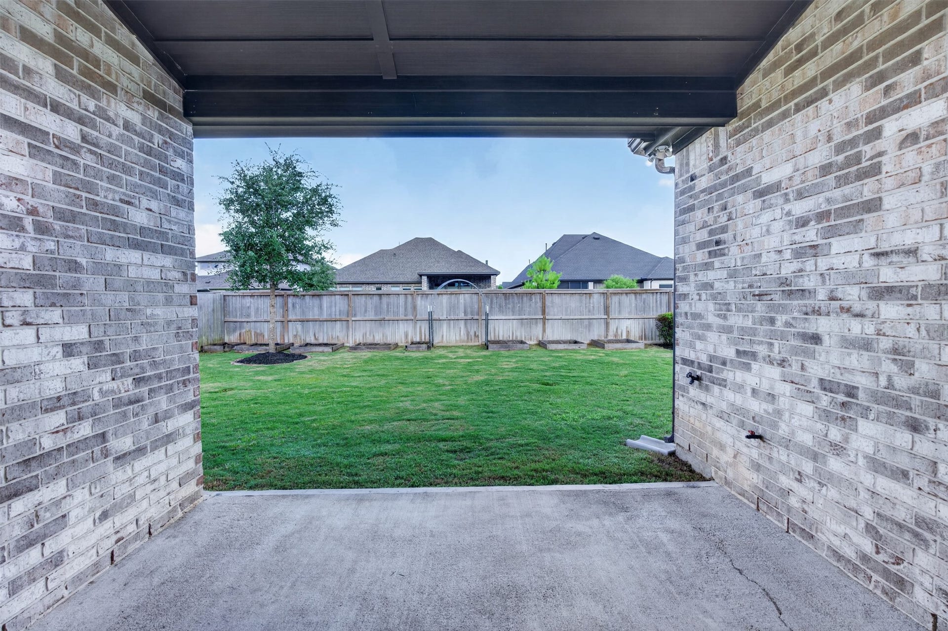 Step outside to a covered patio designed for year-round enjoyment. Whether hosting gatherings, enjoying a quiet morning coffee, or relaxing after a long day, this outdoor living space offers the perfect setting.