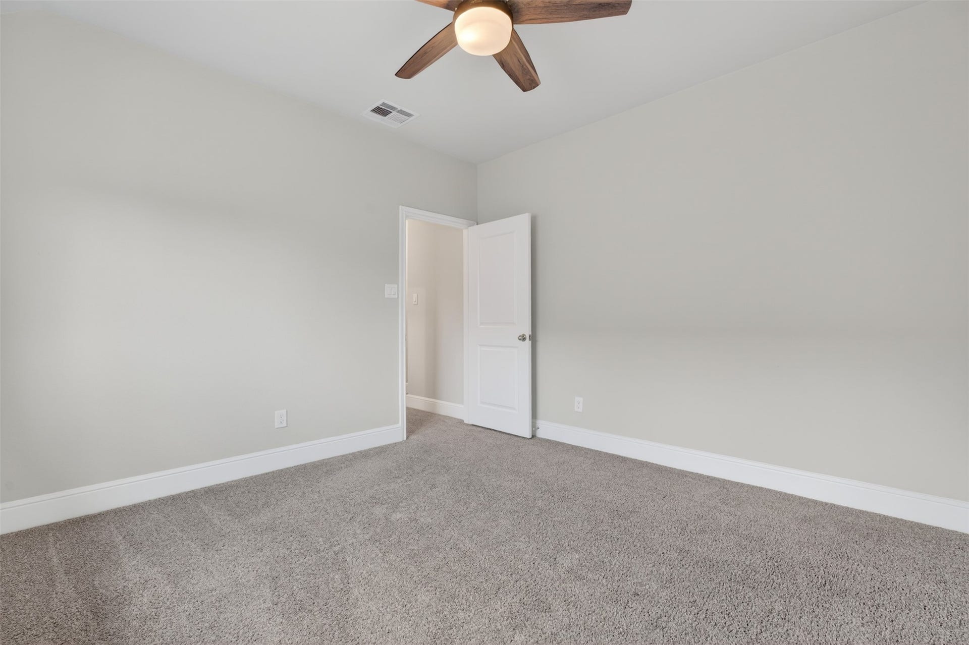 Ceiling fans provide year-round comfort, while neutral finishes create a versatile backdrop for any style.