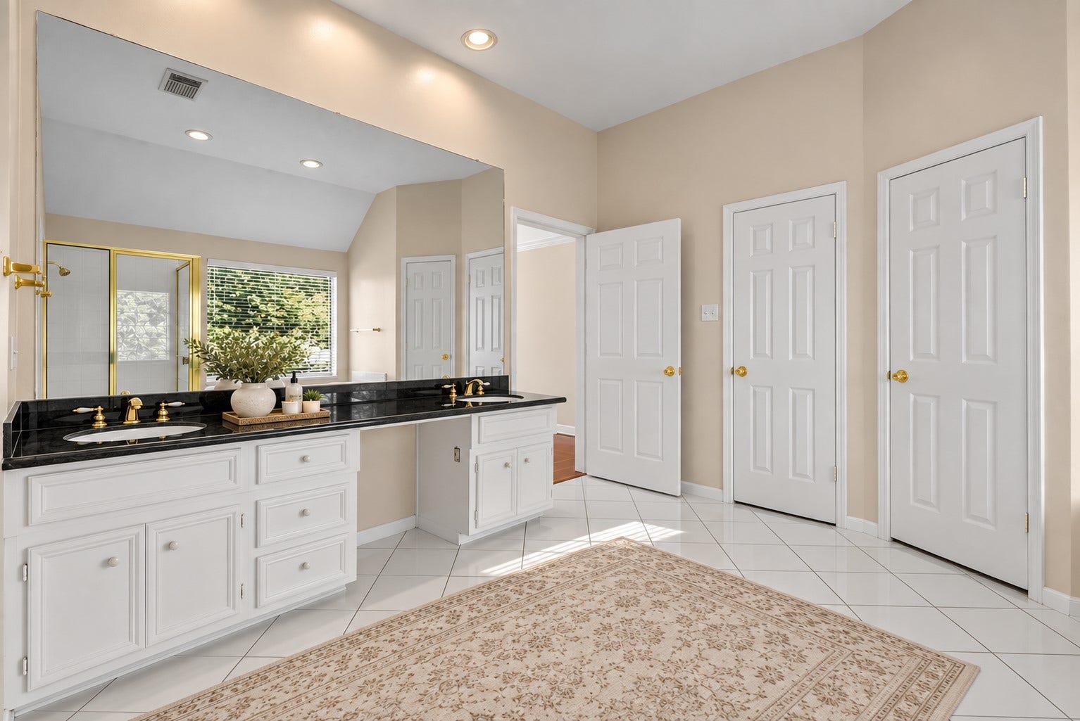 2108 Cherry Hills Drive, League City, TX 77573 The primary bedroom features a private en-suite featuring dual sinks, soaking tub and separate walk-in shower.