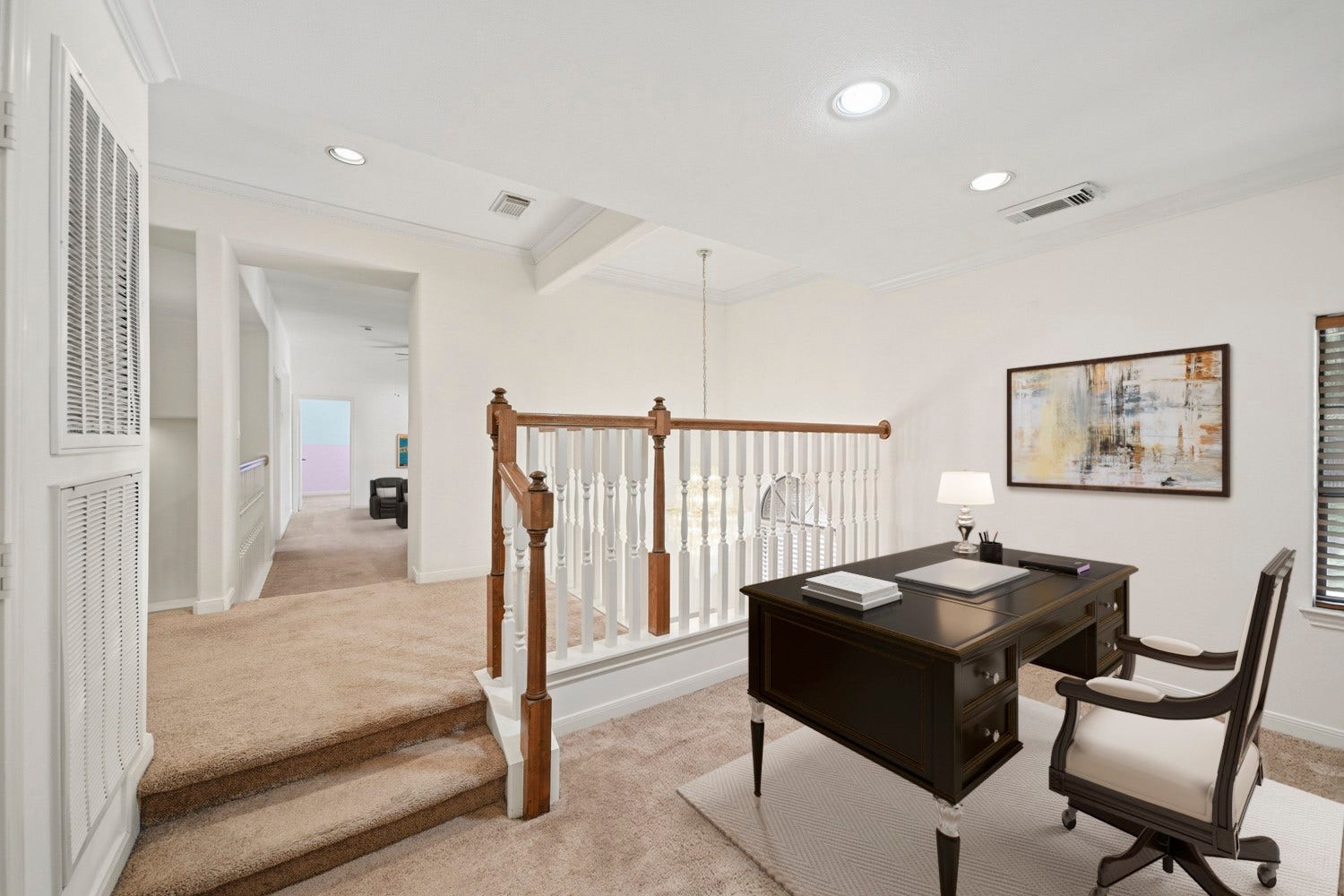 16 Fosters Court, Sugar Land, TX 77479 Virtually Staged: This versatile upstairs loft features an open layout overlooking the staircase, with recessed lighting, crown molding, and soft carpeting.
