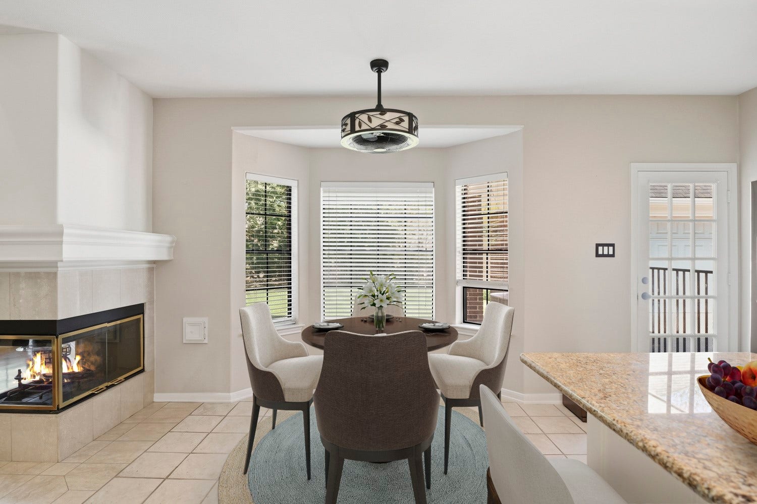 16 Fosters Court, Sugar Land, TX 77479 Virtually Staged: This inviting breakfast nook features a bright bay of windows that fills the space with natural light and offers pleasant backyard views. Positioned just off the kitchen, the breakfast area provides plenty of room for everyday meals and casual gatherings. A double-sided fireplace adds warmth and character, creating a cozy connection between the breakfast nook and adjoining family room.
