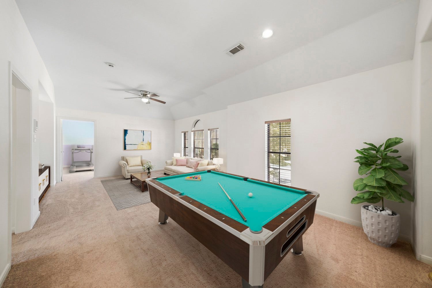 16 Fosters Court, Sugar Land, TX 77479 Virtually Staged: This spacious game room is designed for entertaining, it can fit a full-size pool table, multiple seating areas, and holds plenty of room for additional recreation. It is complete with vaulted ceilings, and abundant natural light.