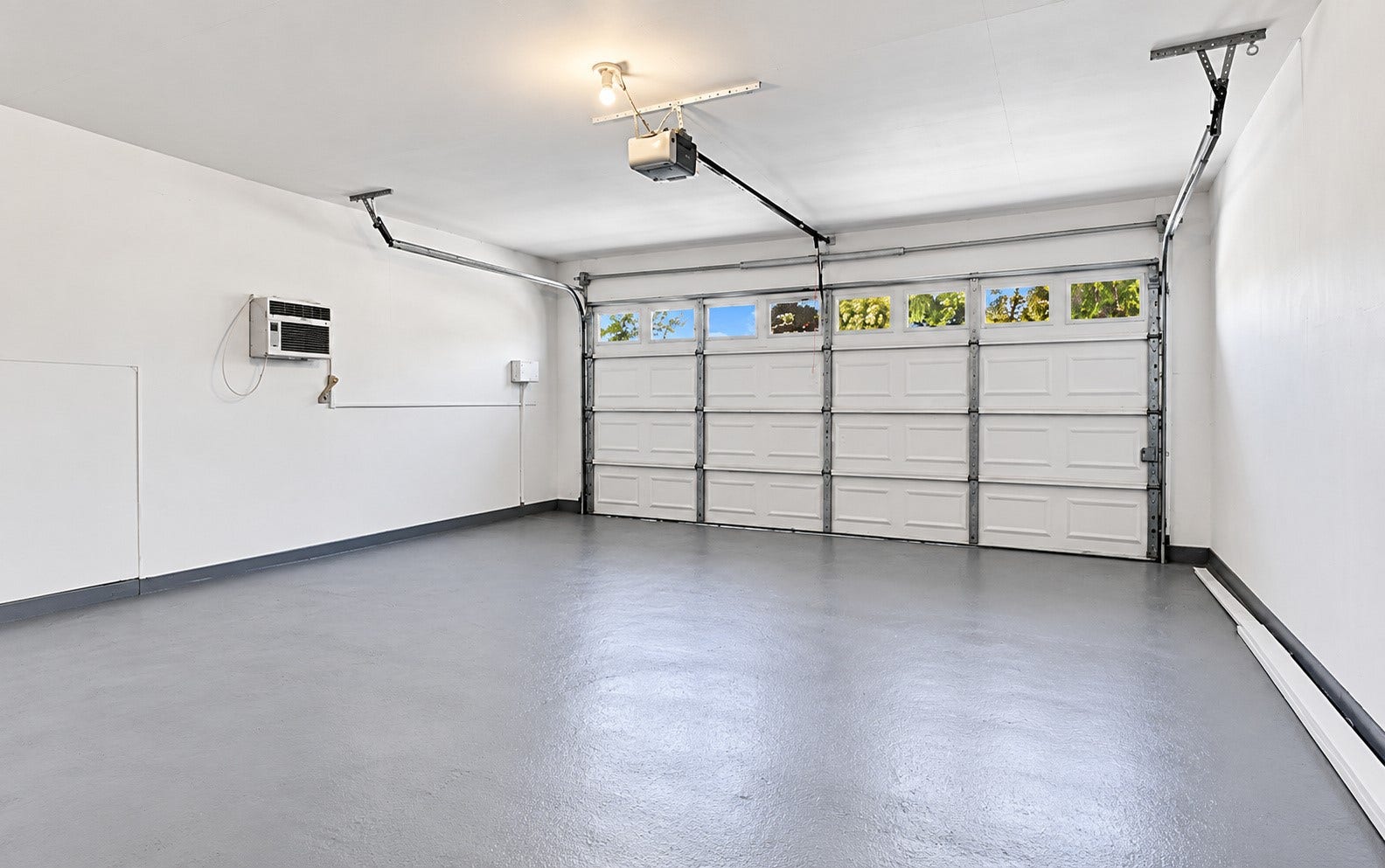 718 Land Grant Drive, Richmond, TX 77406 The two-car garage has a wall unit for comfort!