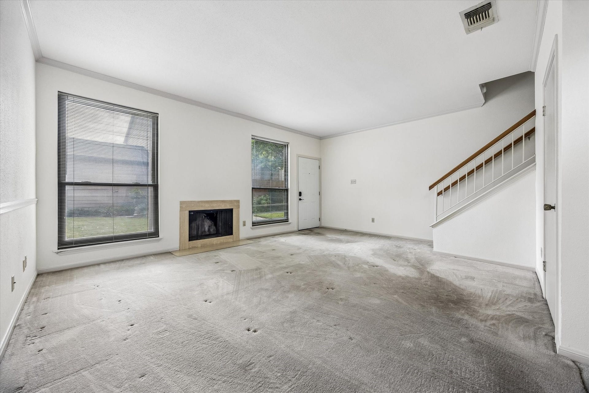 1201 Mcduffie Street, #219, Houston, TX 77019 High ceilings with a wood burning fireplace in the living room
