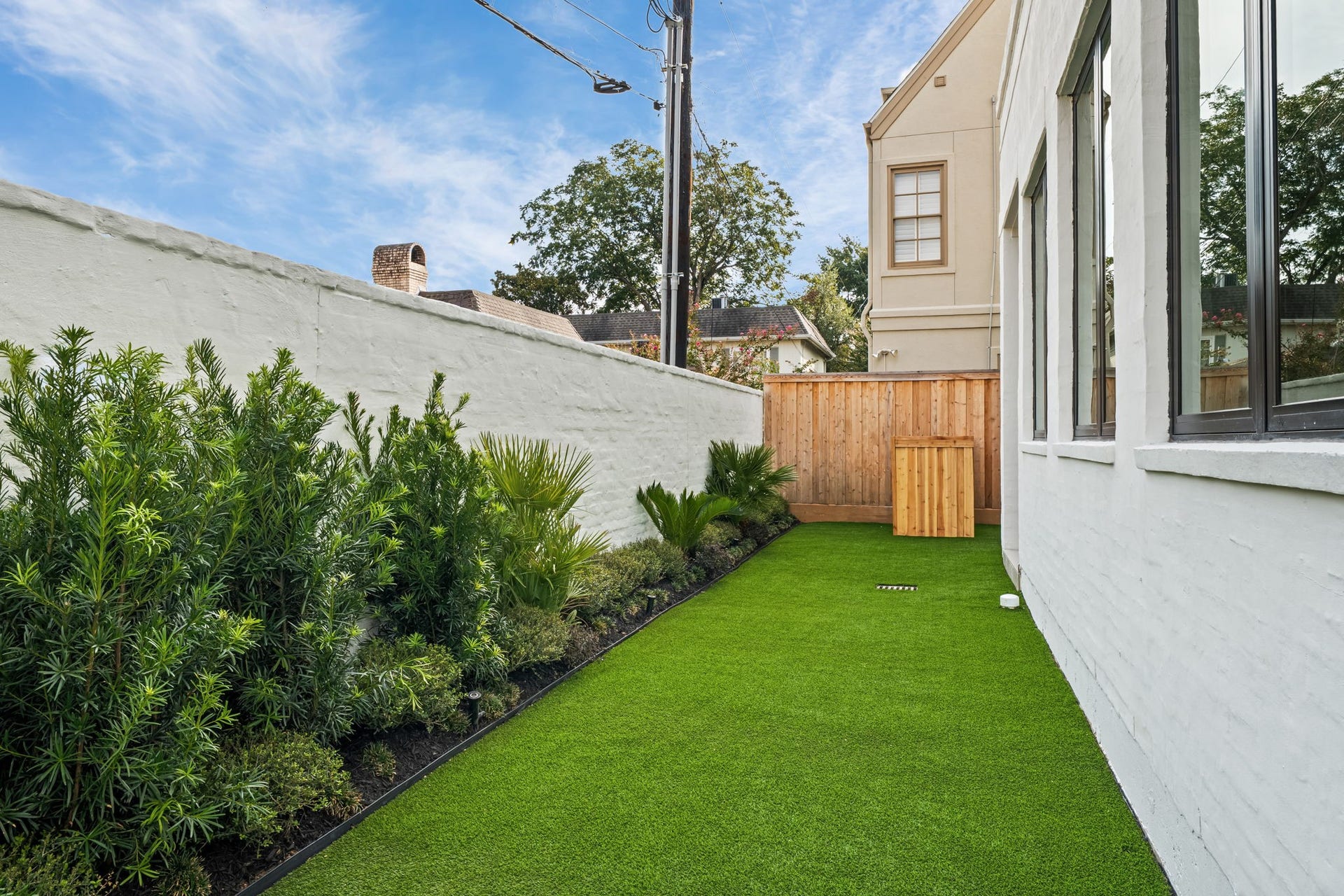 5409 Chevy Chase, #D, Houston, TX 77056 Private, artificial turf yard space with gorgeous landscaping and views from the first-floor living.