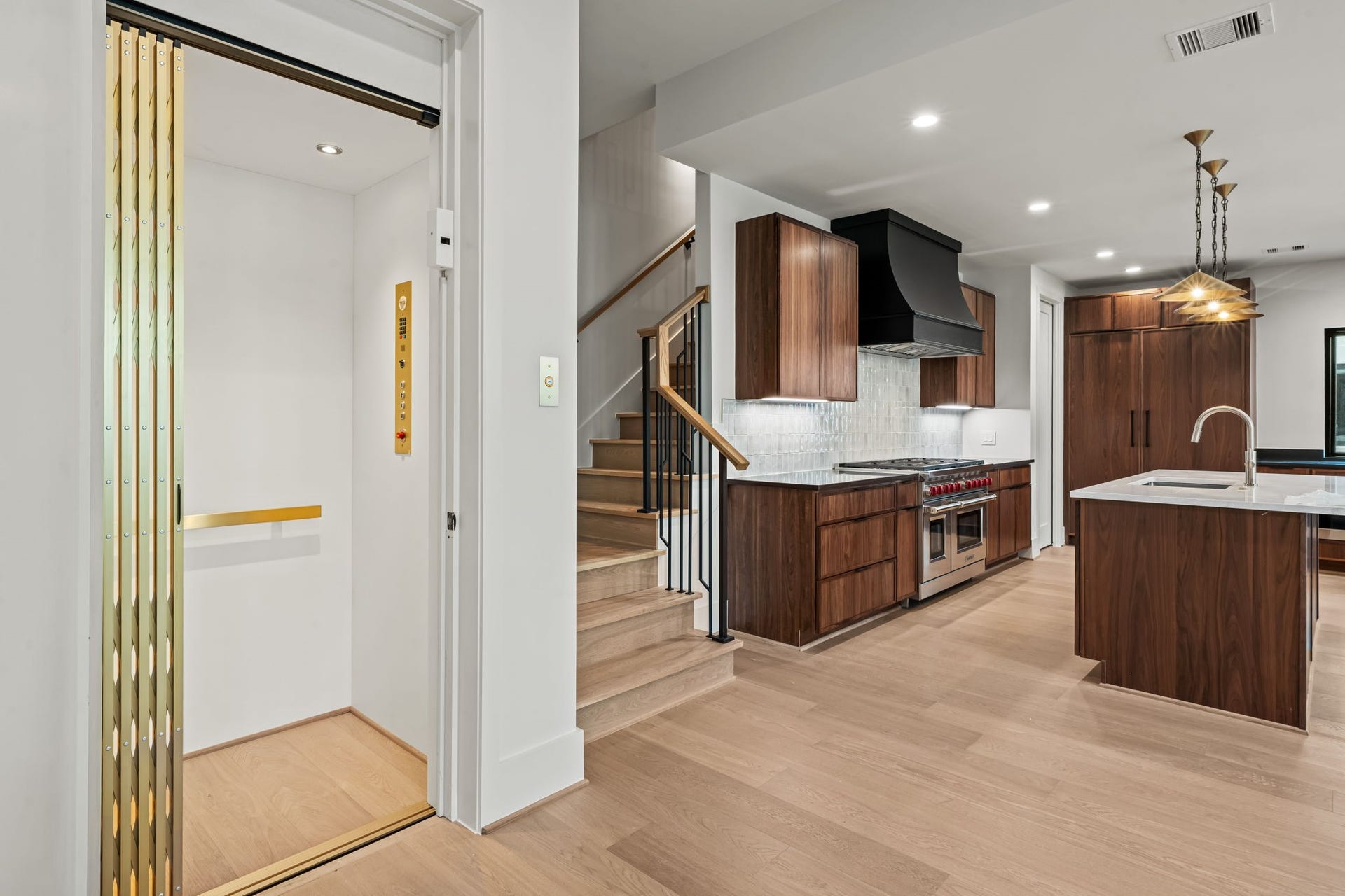 5409 Chevy Chase, #D, Houston, TX 77056 Elevator appointment in comparison to the kitchen and staircase.