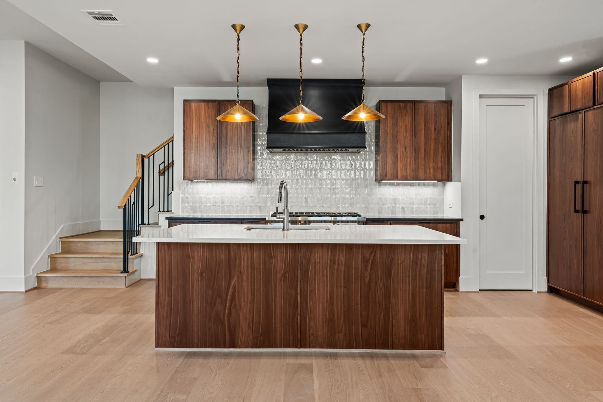 5409 Chevy Chase, #D, Houston, TX 77056 Island kitchen with breakfast bar, luxury appliances, and spacious walk-in pantry.